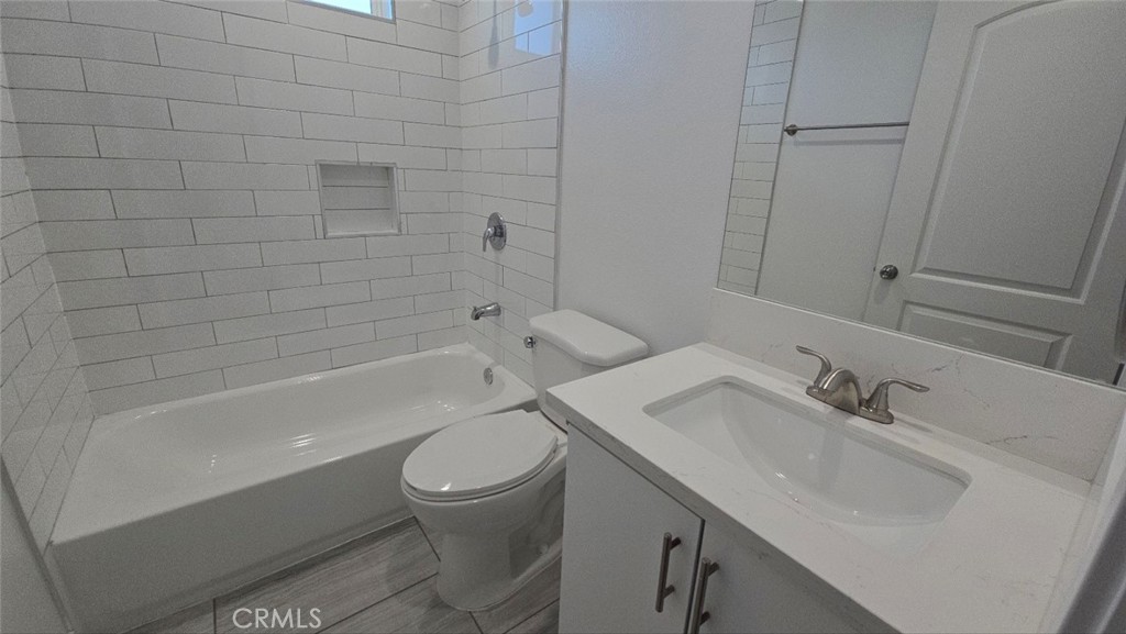 10415 South Avalon Boulevard Los Angeles, CA 90003 - Photo 24 of 40 a bathroom with a sink toilet and shower
