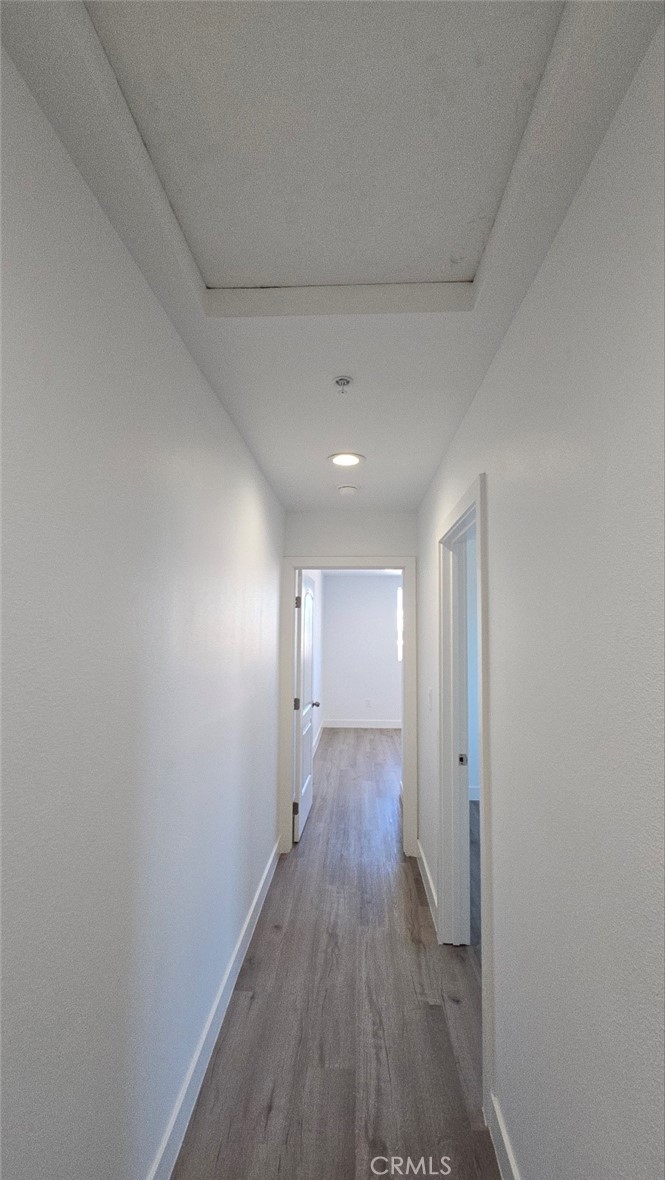10415 South Avalon Boulevard Los Angeles, CA 90003 - Photo 27 of 40 a view of a hallway with wooden floor