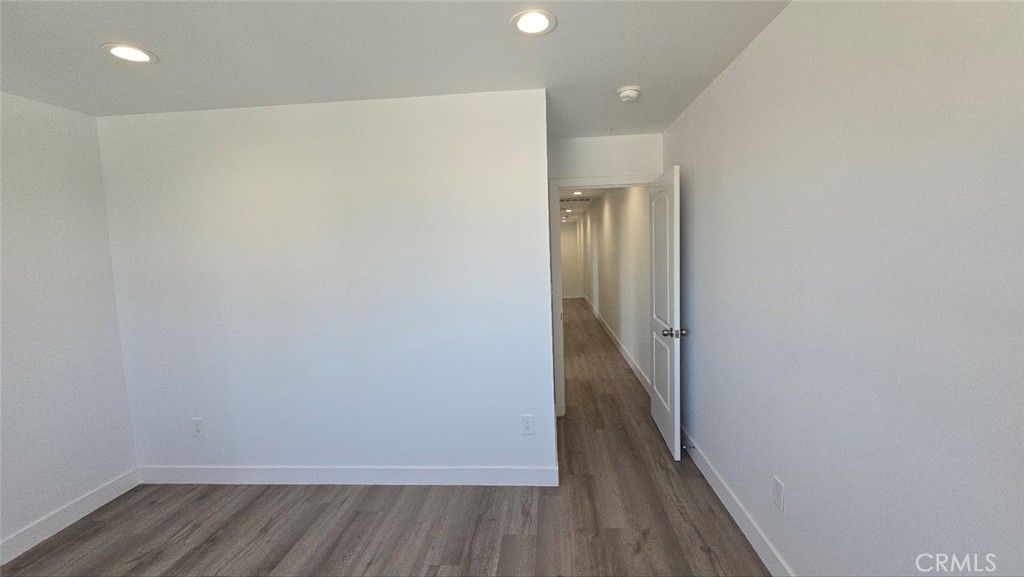 10415 South Avalon Boulevard Los Angeles, CA 90003 - Photo 30 of 40 a view of a hallway with wooden floor