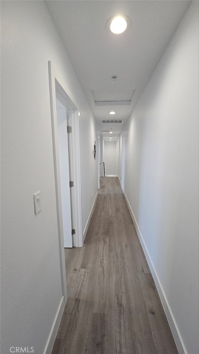 10415 South Avalon Boulevard Los Angeles, CA 90003 - Photo 31 of 40 a view of a hallway with wooden floor