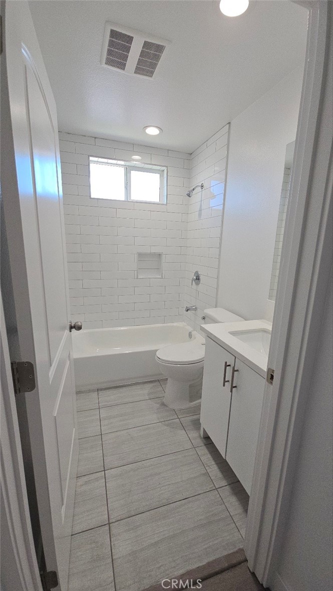 10415 South Avalon Boulevard Los Angeles, CA 90003 - Photo 33 of 40 a bathroom with a sink a toilet and shower