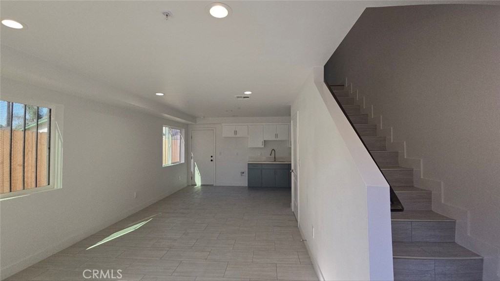 10415 South Avalon Boulevard Los Angeles, CA 90003 - Photo 4 of 40 an entryway in a hall with a window