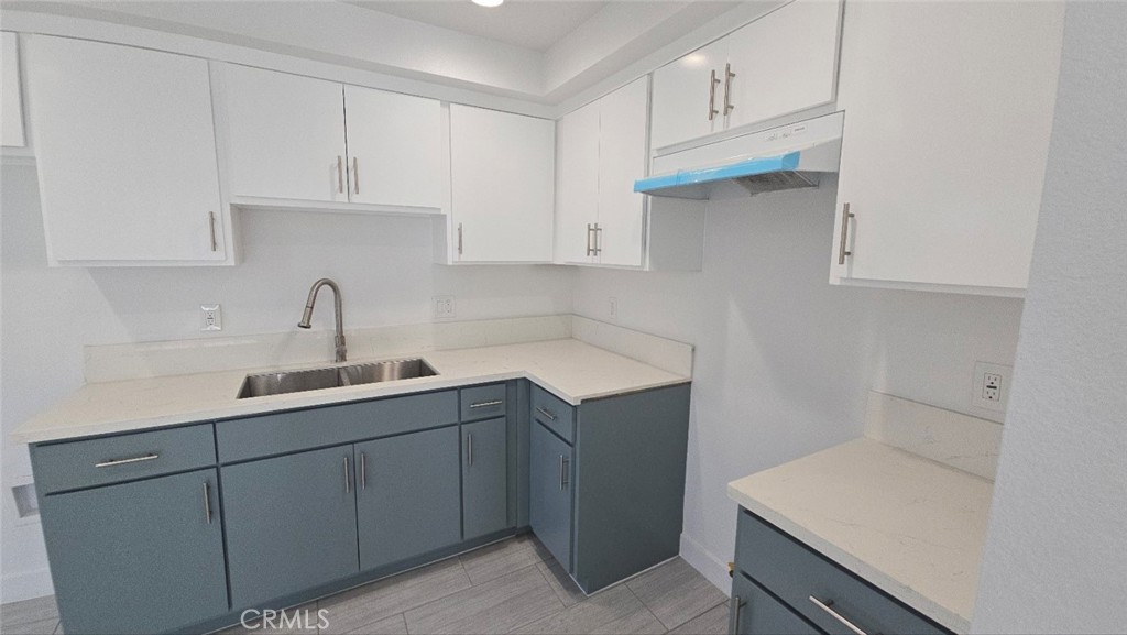 10415 South Avalon Boulevard Los Angeles, CA 90003 - Photo 8 of 40 a kitchen with a sink cabinets and appliances