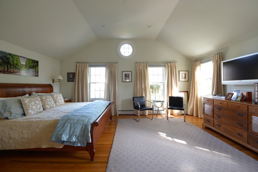 5 Ingraham Road Wellesley, MA 02482 - Photo 7 of 11 a bedroom with a bed and flat screen tv