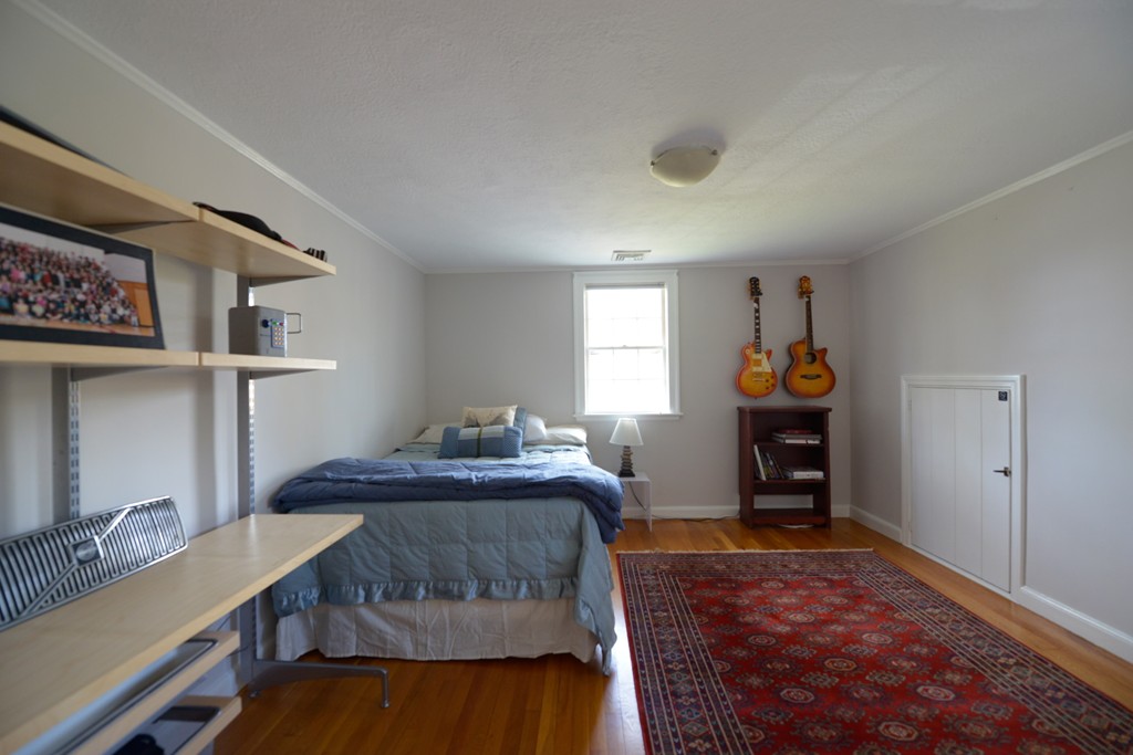 5 Ingraham Road Wellesley, MA 02482 - Photo 8 of 11 a bedroom with a bed and a window
