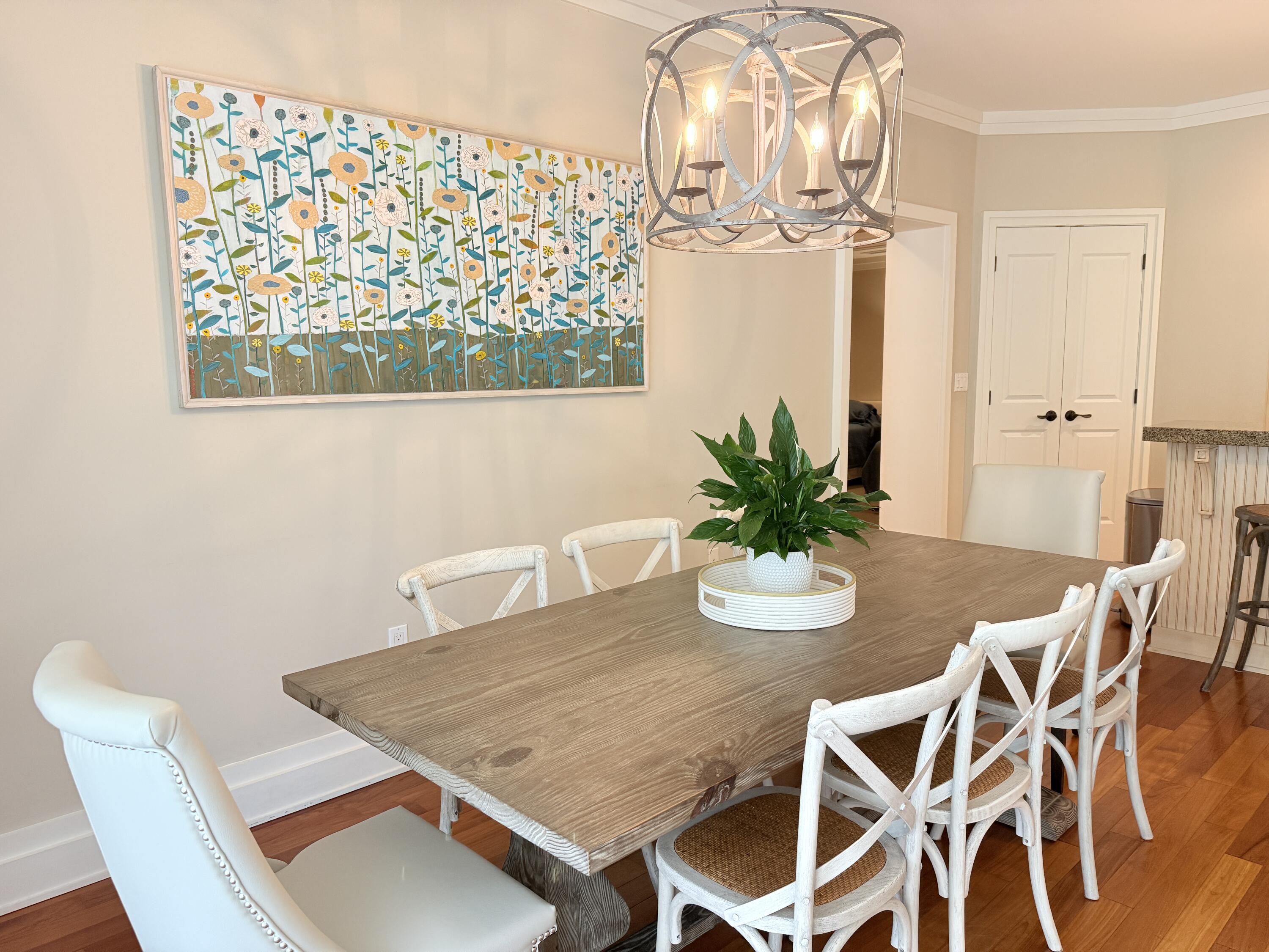32461 East County Highway 30A, Unit 104 Inlet Beach, FL 32461 - Photo 14 of 97 a view of a dining room with furniture and wooden floor