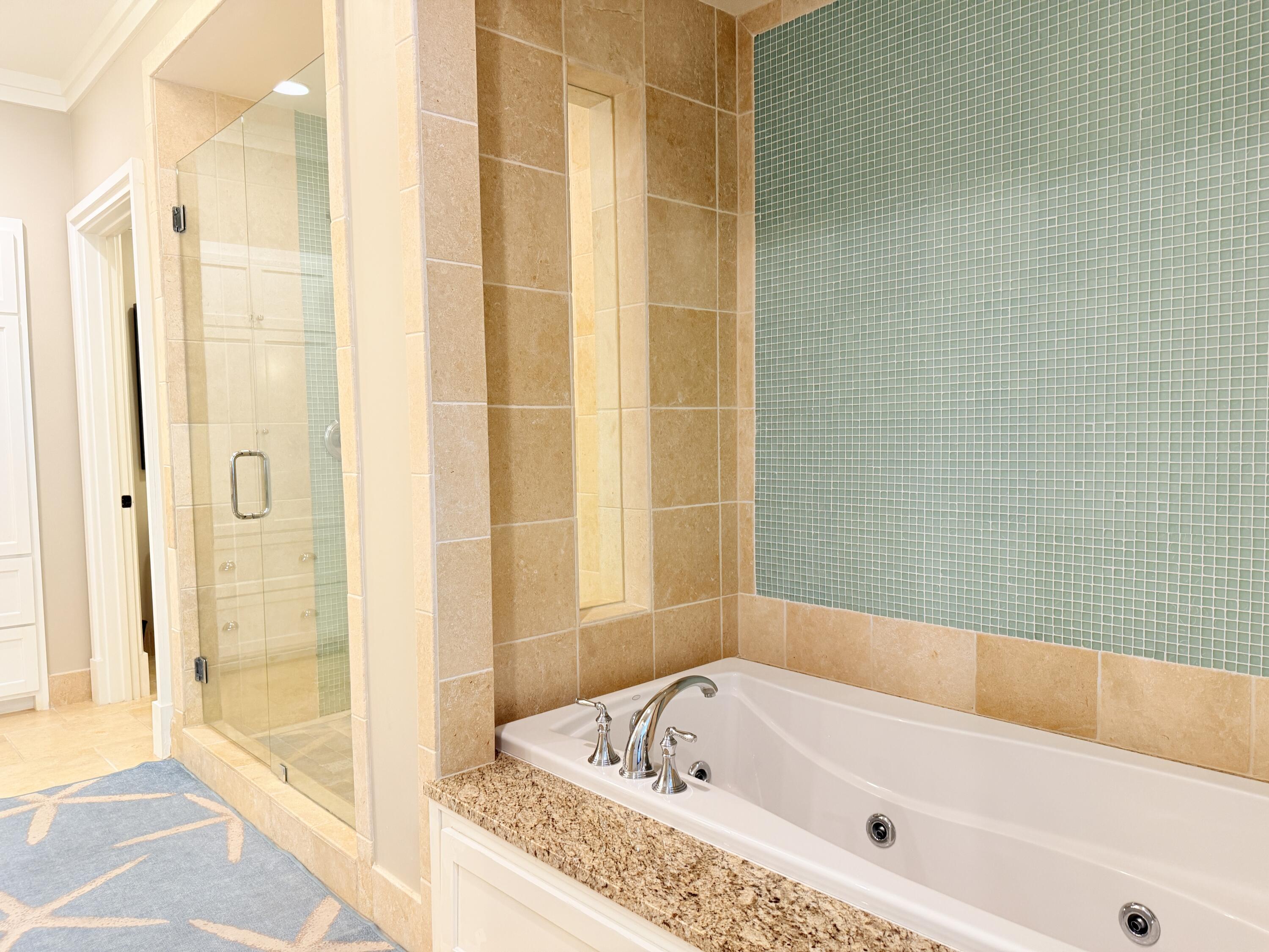 32461 East County Highway 30A, Unit 104 Inlet Beach, FL 32461 - Photo 29 of 97 a bathroom with a tub and shower