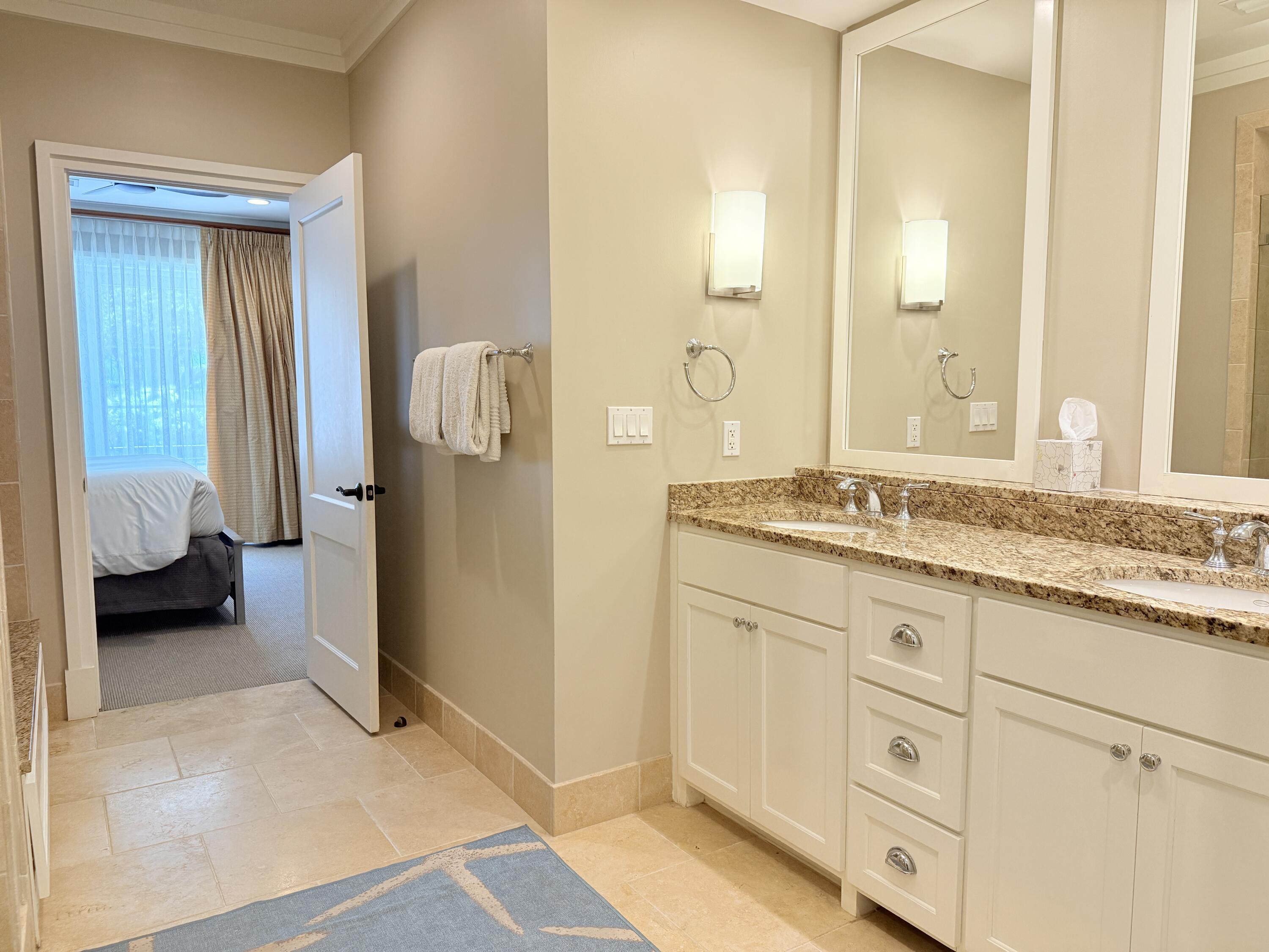 32461 East County Highway 30A, Unit 104 Inlet Beach, FL 32461 - Photo 34 of 97 a en suite bathroom with a granite countertop sink and a mirror