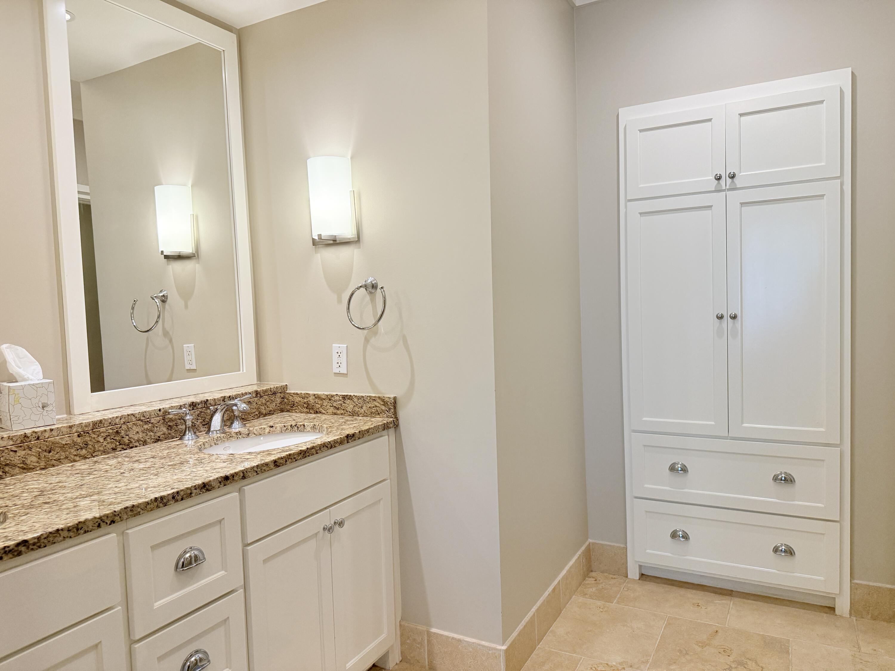 32461 East County Highway 30A, Unit 104 Inlet Beach, FL 32461 - Photo 35 of 97 a bathroom with a granite countertop sink and a mirror