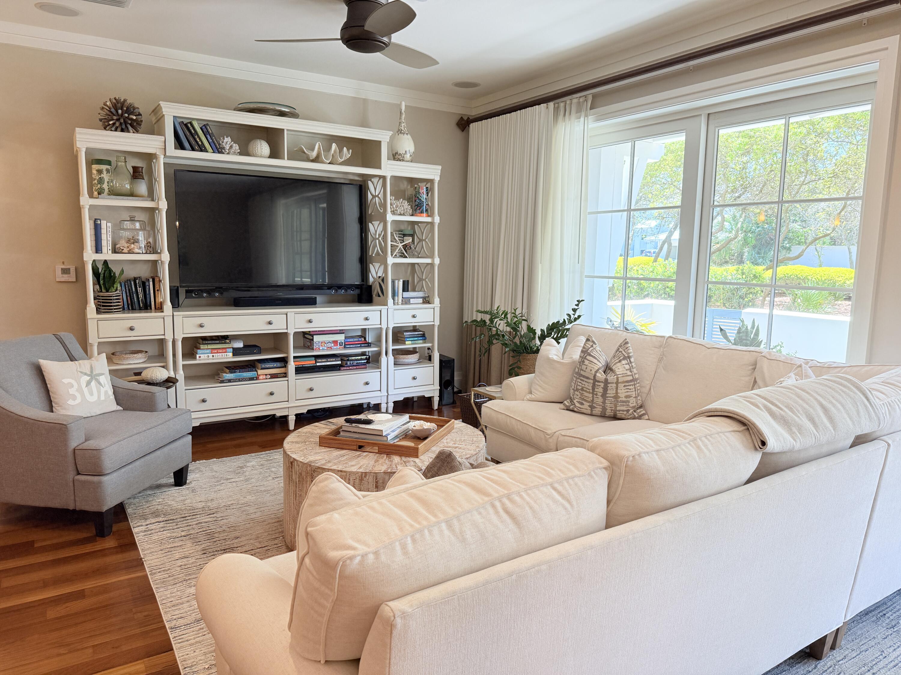 32461 East County Highway 30A, Unit 104 Inlet Beach, FL 32461 - Photo 37 of 97 a living room with furniture and a flat screen tv