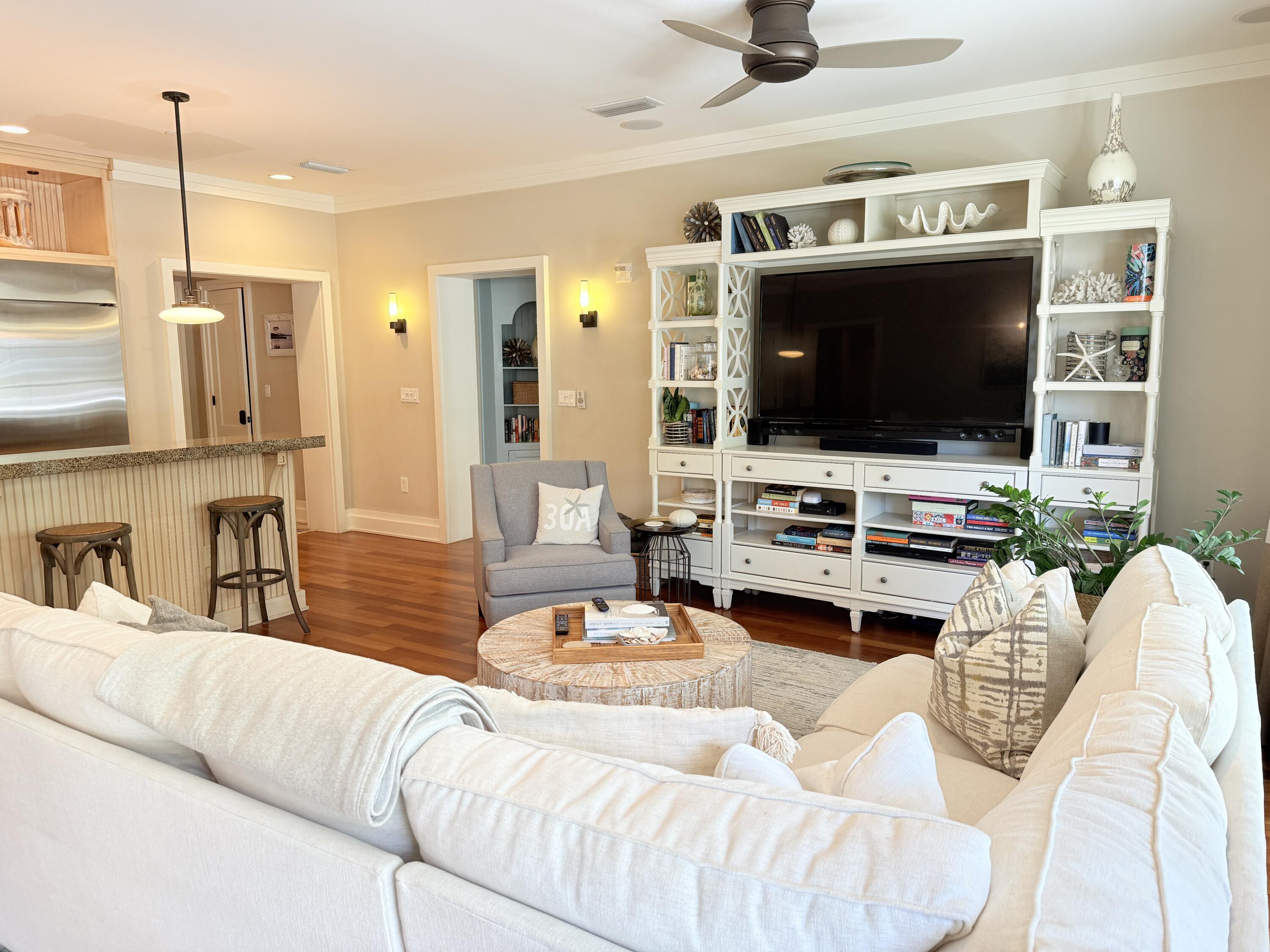 32461 East County Highway 30A, Unit 104 Inlet Beach, FL 32461 - Photo 38 of 97 a living room with furniture and a flat screen tv