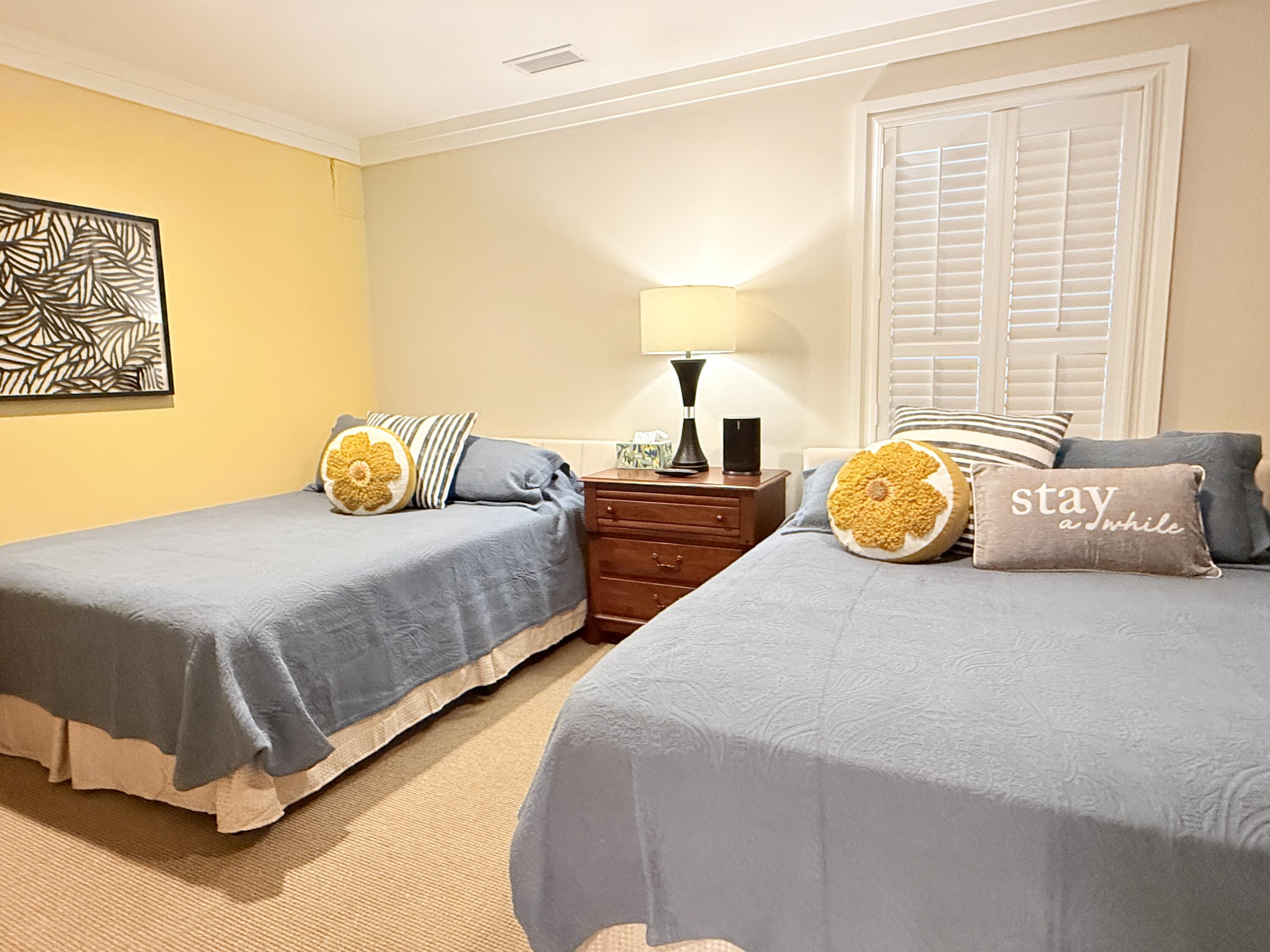 32461 East County Highway 30A, Unit 104 Inlet Beach, FL 32461 - Photo 50 of 97 a bedroom with two bed and lamp