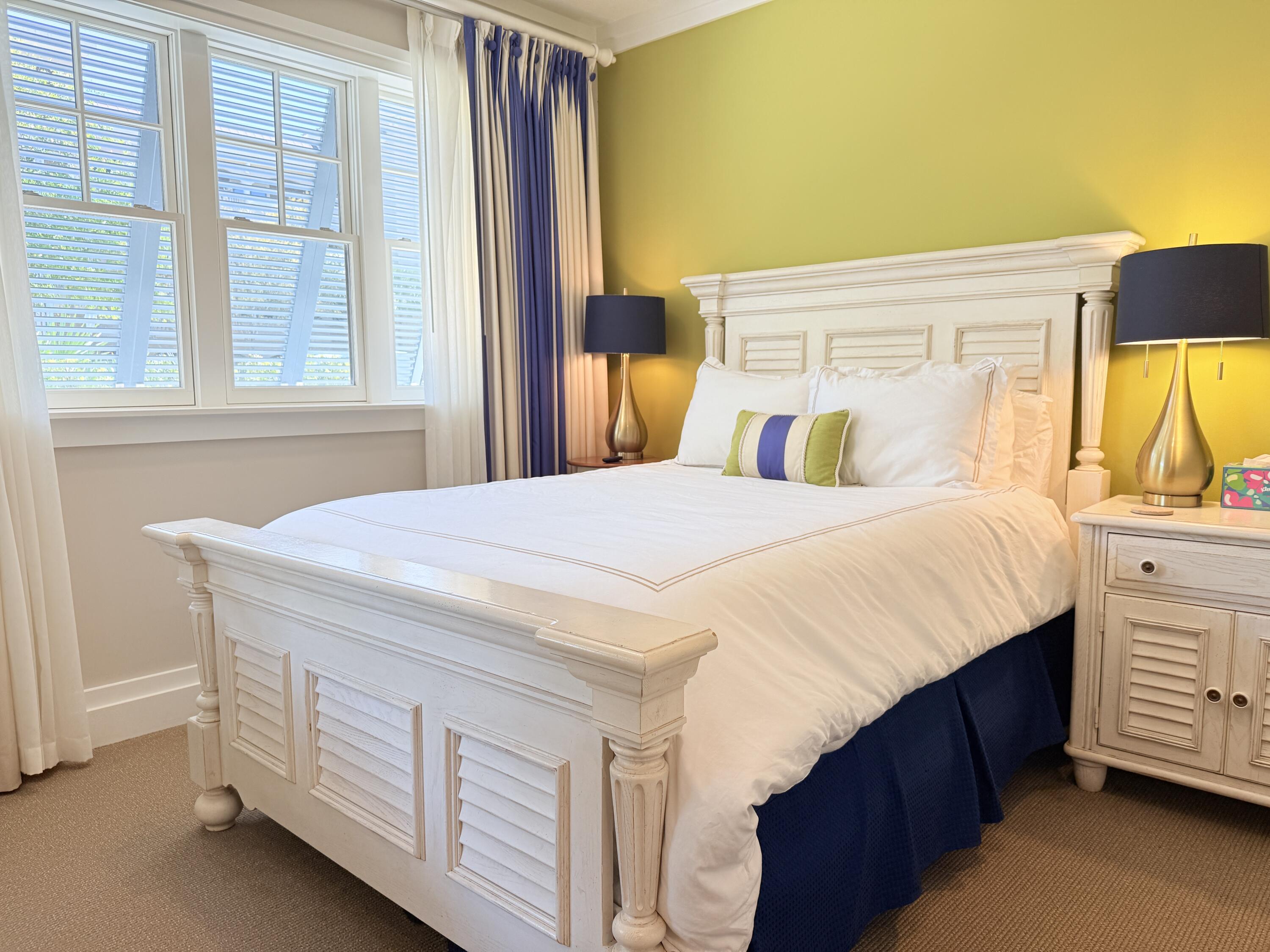 32461 East County Highway 30A, Unit 104 Inlet Beach, FL 32461 - Photo 59 of 97 a bedroom with a bed and a dresser next to a window