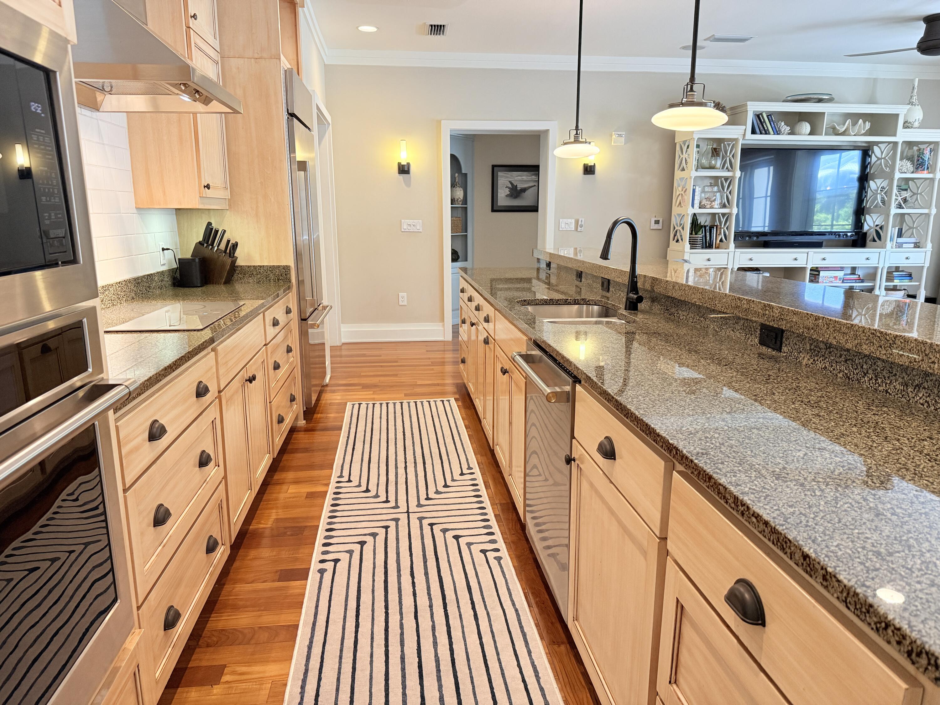 32461 East County Highway 30A, Unit 104 Inlet Beach, FL 32461 - Photo 6 of 97 a large kitchen with stainless steel appliances granite countertop a sink and a stove