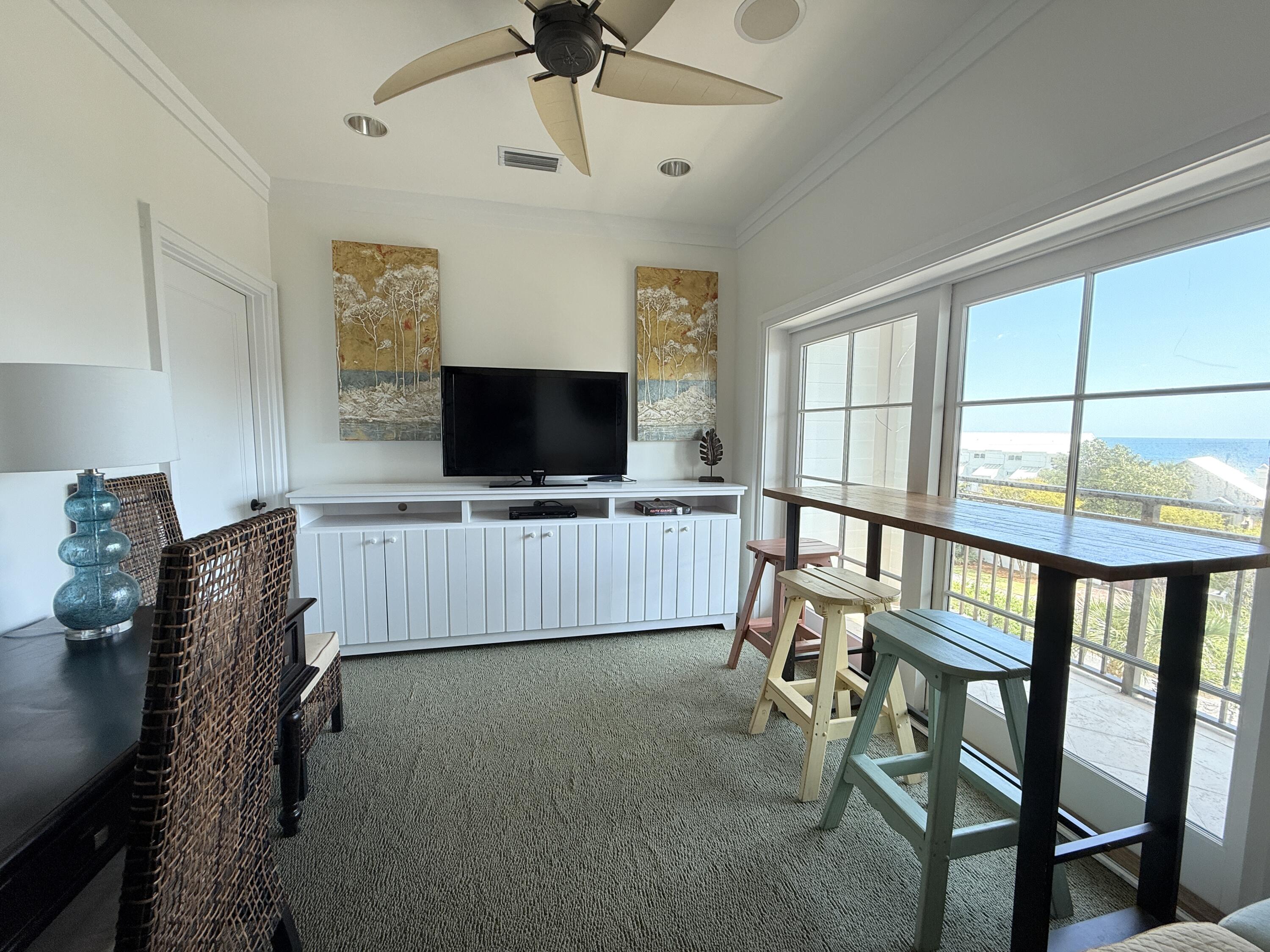 32461 East County Highway 30A, Unit 104 Inlet Beach, FL 32461 - Photo 79 of 97 a living room with furniture and a flat screen tv