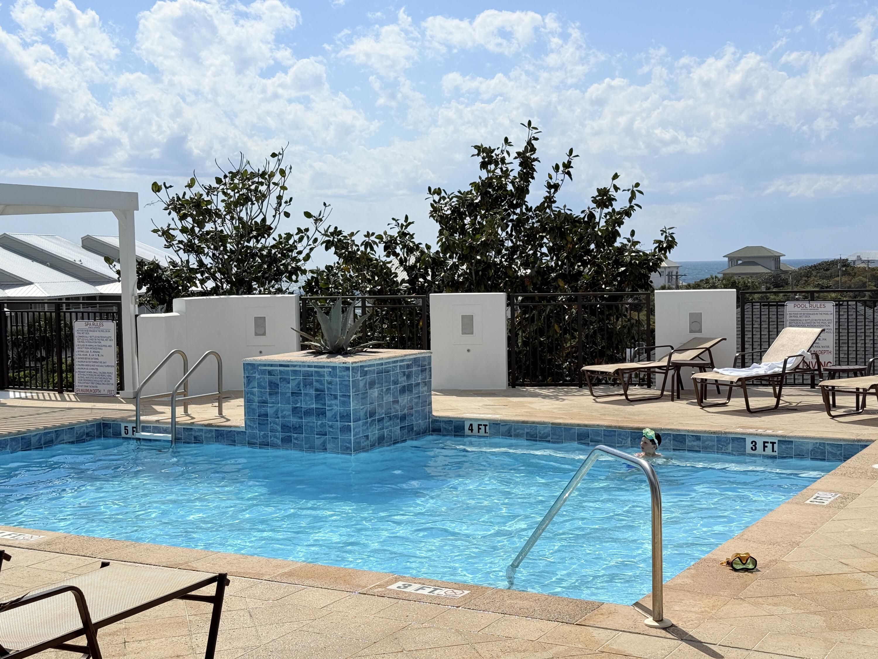 32461 East County Highway 30A, Unit 104 Inlet Beach, FL 32461 - Photo 82 of 97 a view of a house with swimming pool and sitting area