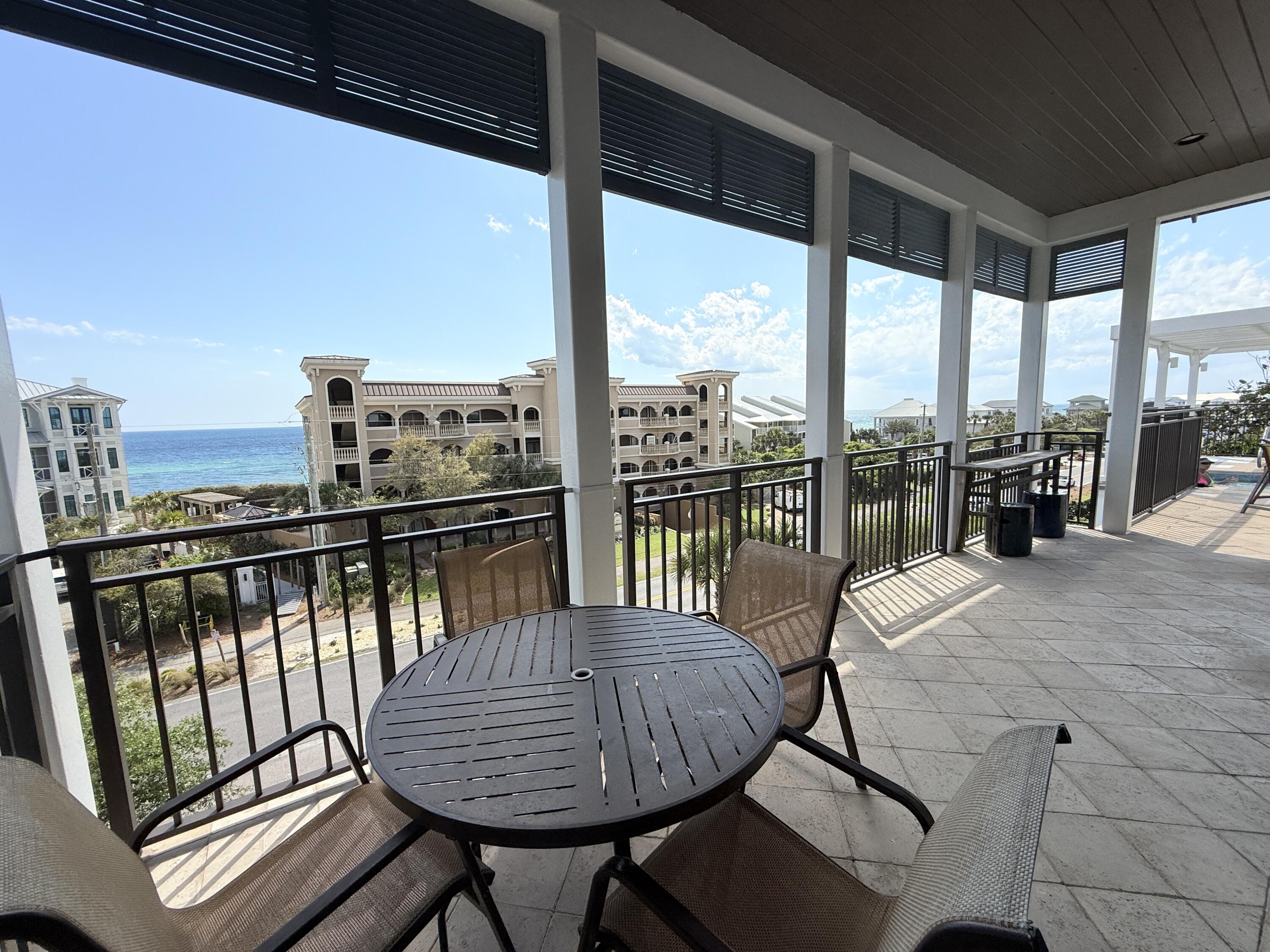 32461 East County Highway 30A, Unit 104 Inlet Beach, FL 32461 - Photo 86 of 97 a view of a balcony with mountain view and wooden floor