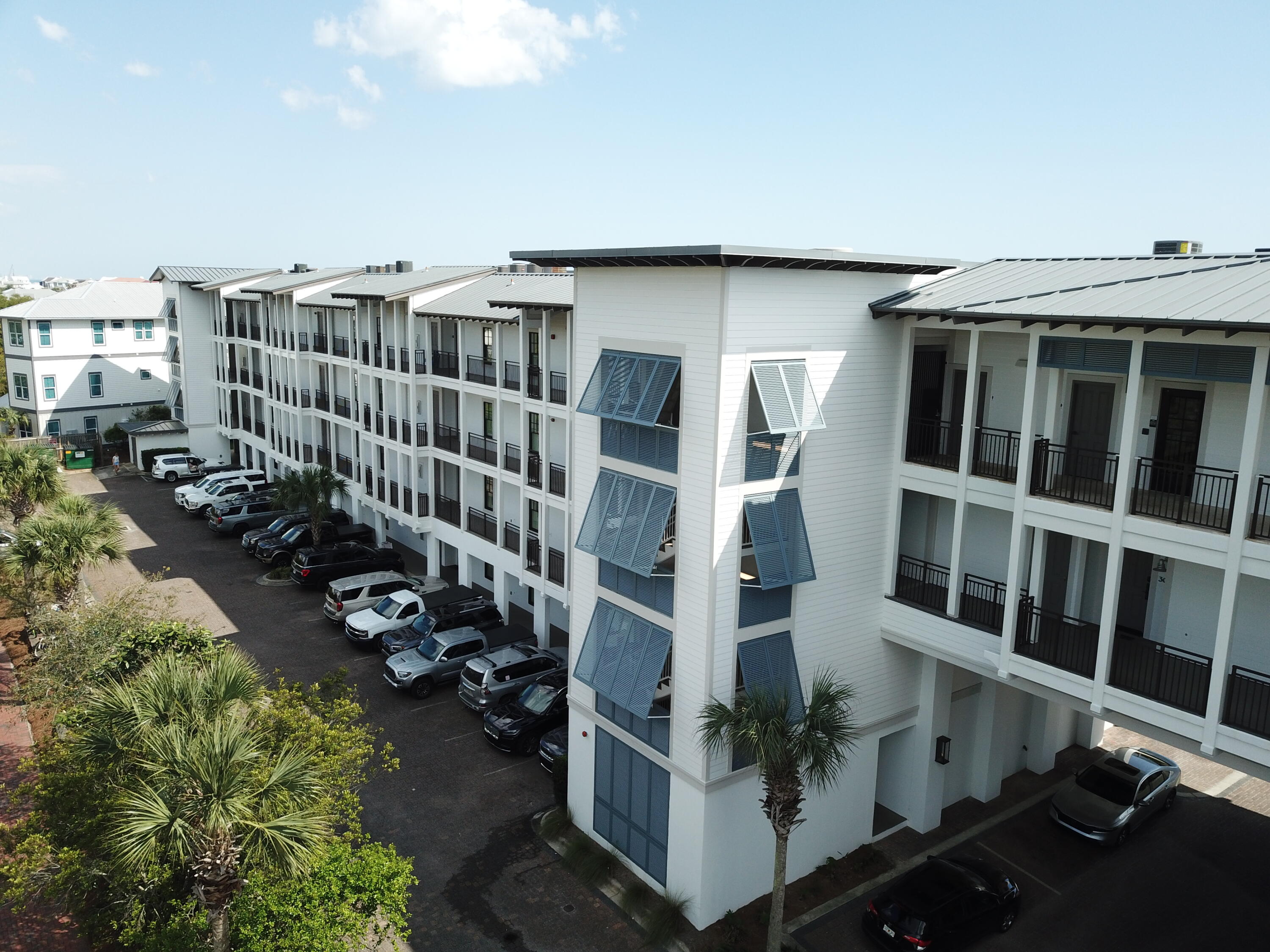 32461 East County Highway 30A, Unit 104 Inlet Beach, FL 32461 - Photo 91 of 97 a view of a balcony with chairs and a yard