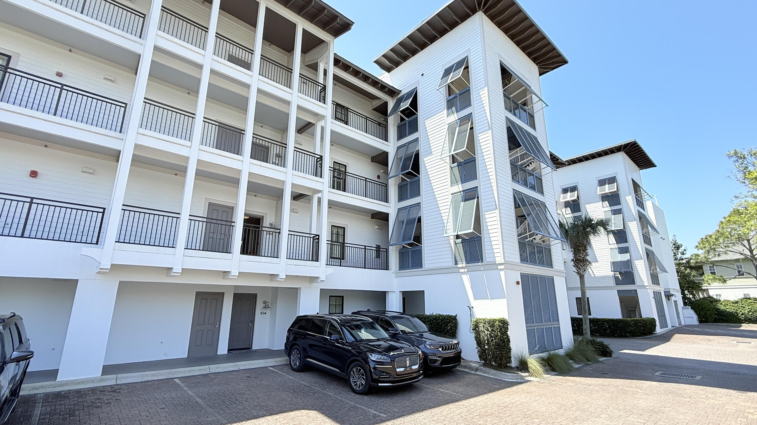 32461 East County Highway 30A, Unit 104 Inlet Beach, FL 32461 - Photo 96 of 97 a car parked in front of a building