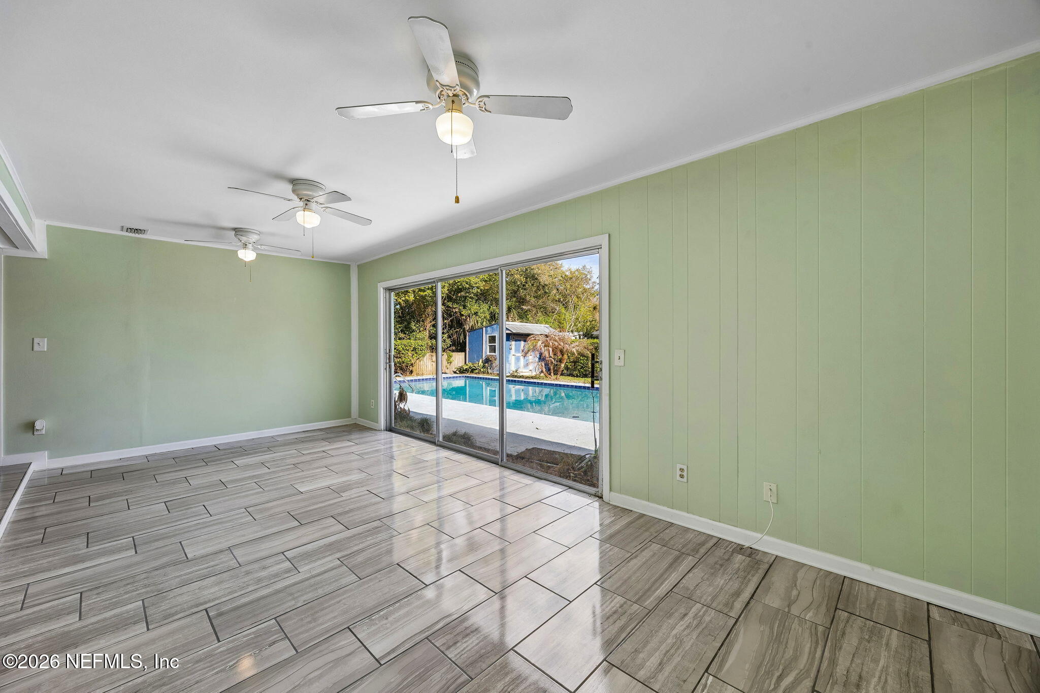 3647 Coronado Road Jacksonville, FL 32217 - Photo 15 of 49 a view of an empty room with a window
