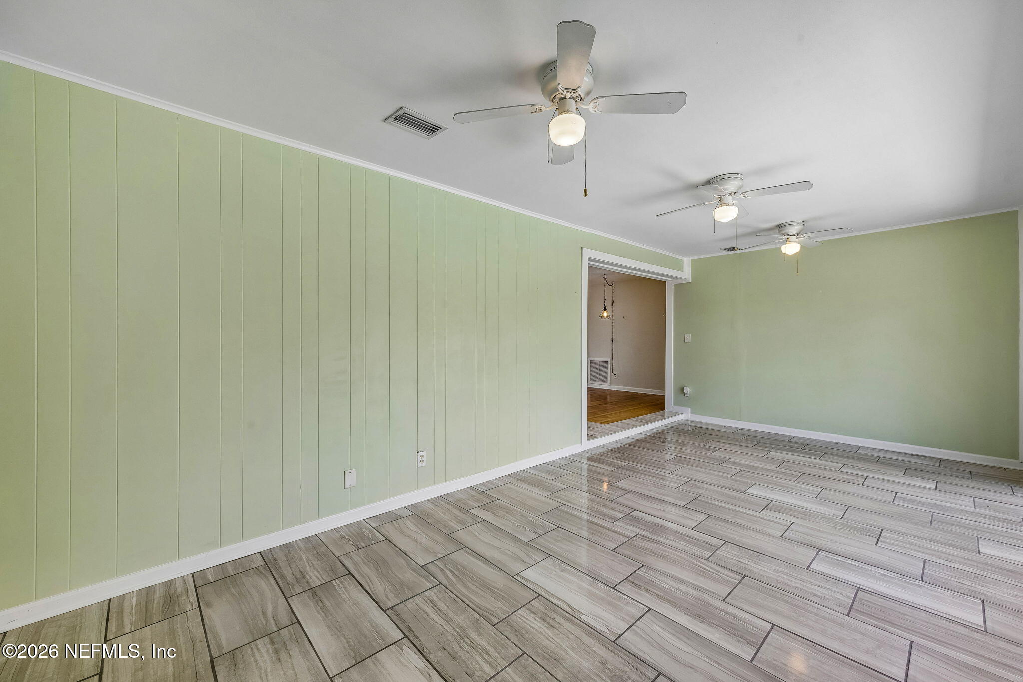 3647 Coronado Road Jacksonville, FL 32217 - Photo 16 of 49 a view of an empty room with wooden floor