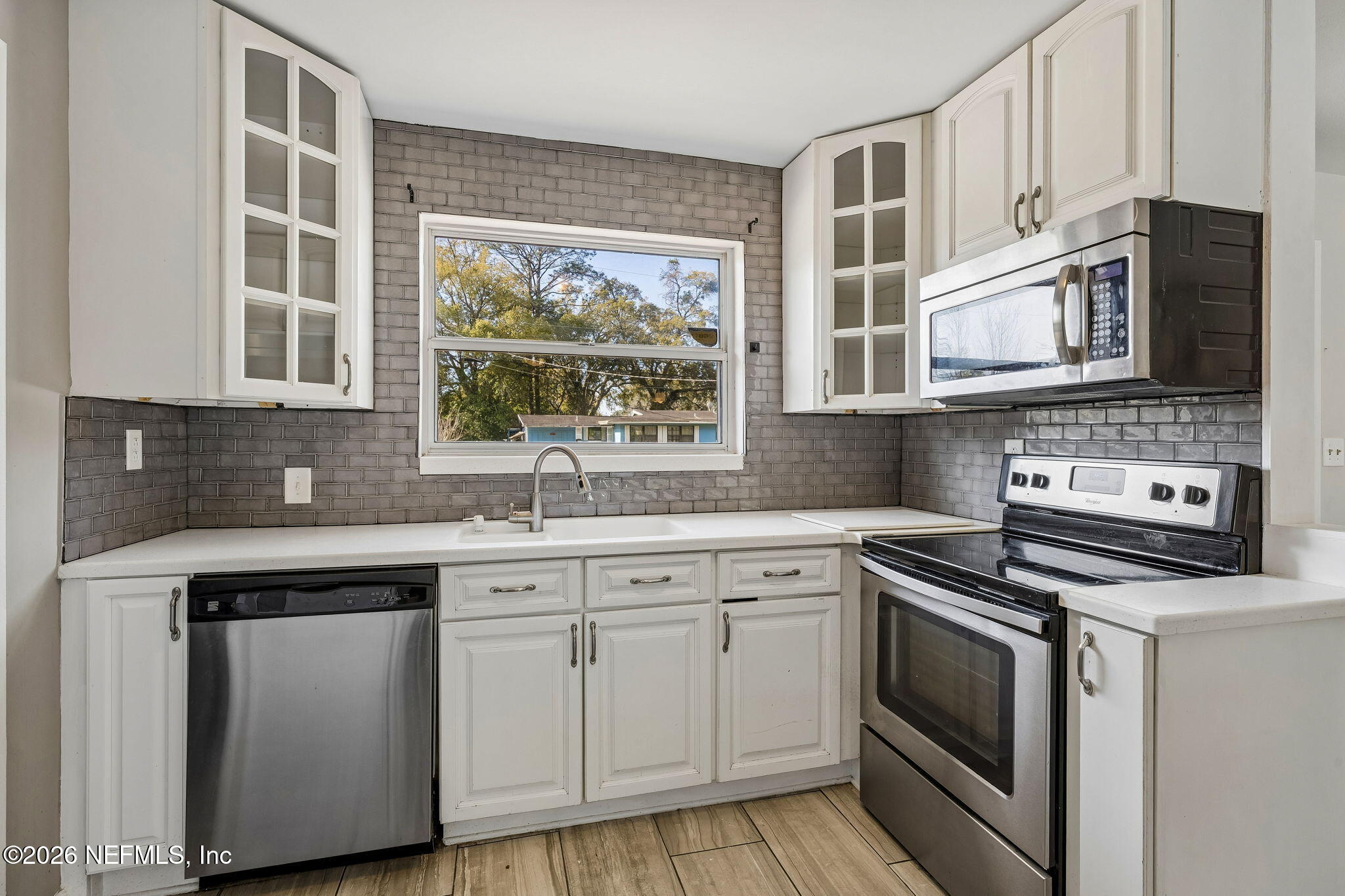 3647 Coronado Road Jacksonville, FL 32217 - Photo 19 of 49 a kitchen with cabinets appliances and a sink