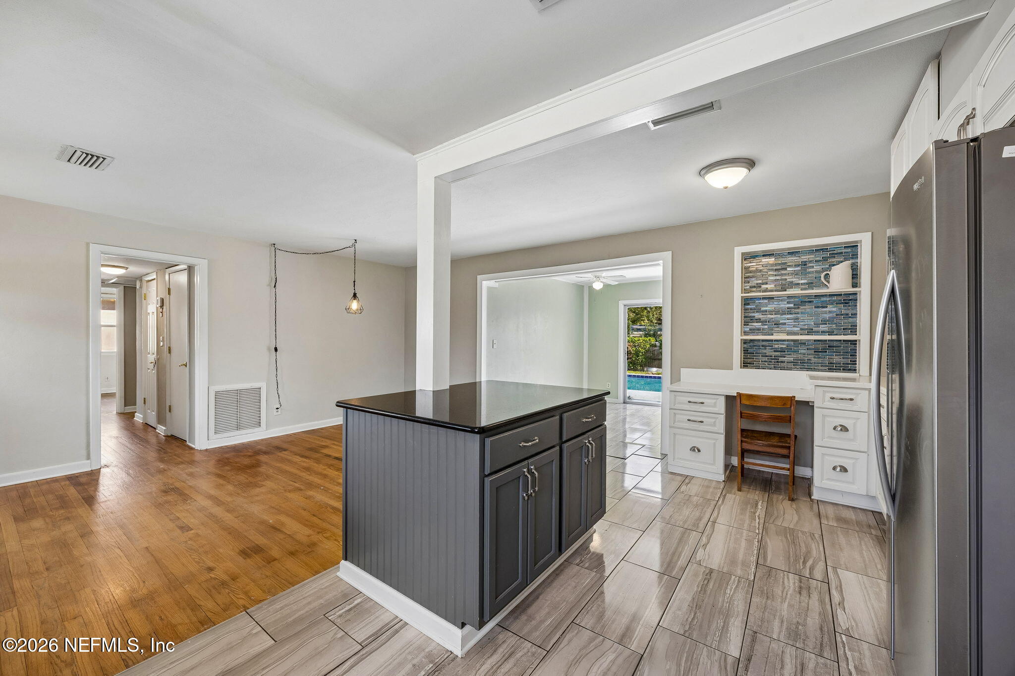 3647 Coronado Road Jacksonville, FL 32217 - Photo 20 of 49 a kitchen with granite countertop a stove top oven and sink
