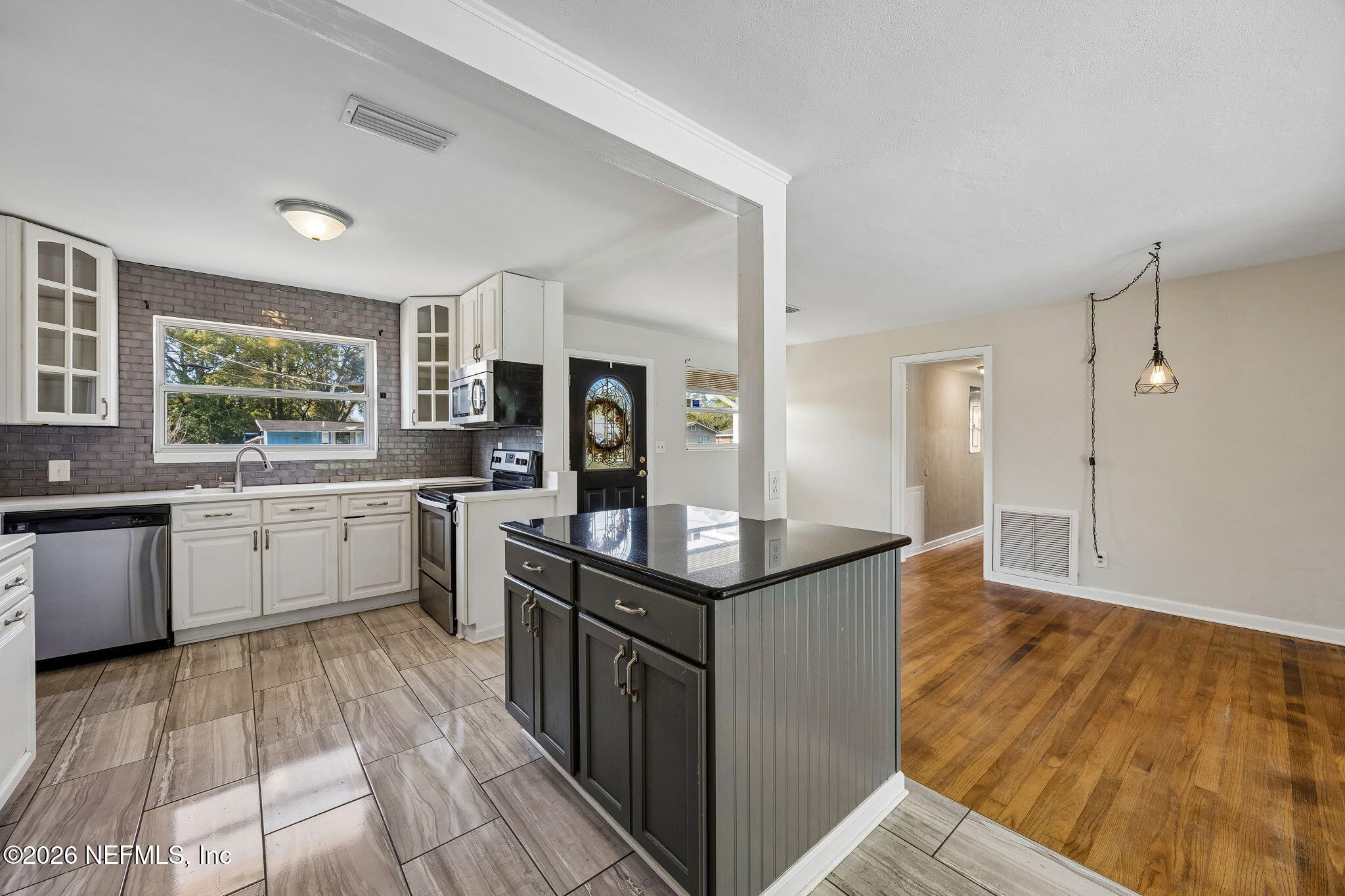 3647 Coronado Road Jacksonville, FL 32217 - Photo 21 of 49 a kitchen with stainless steel appliances granite countertop a sink stove and refrigerator