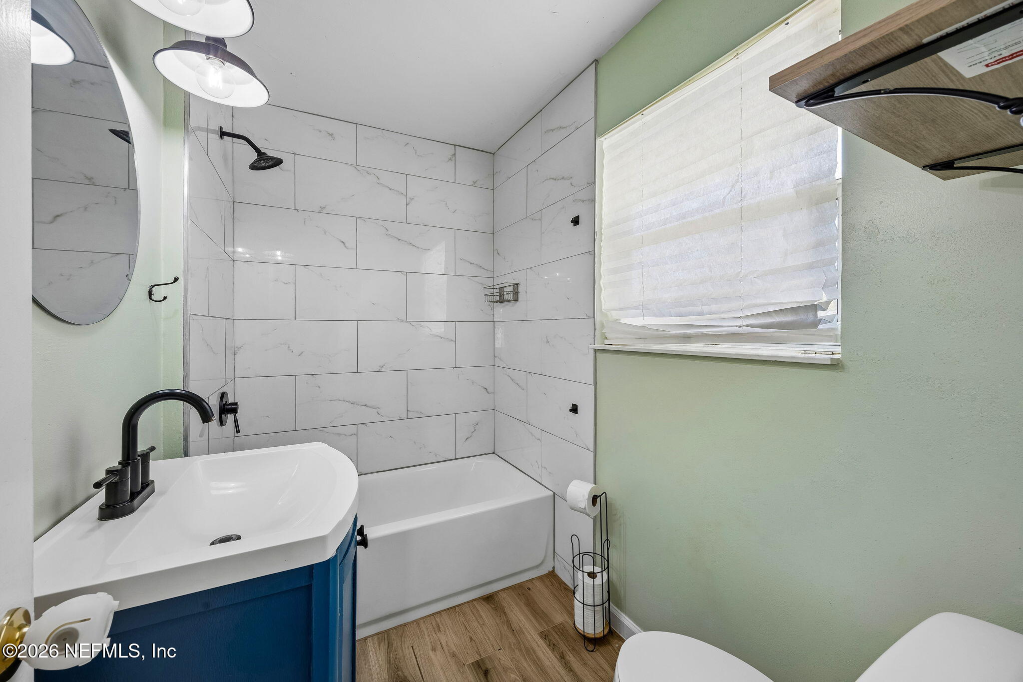 3647 Coronado Road Jacksonville, FL 32217 - Photo 34 of 49 a bathroom with a sink mirror toilet and shower