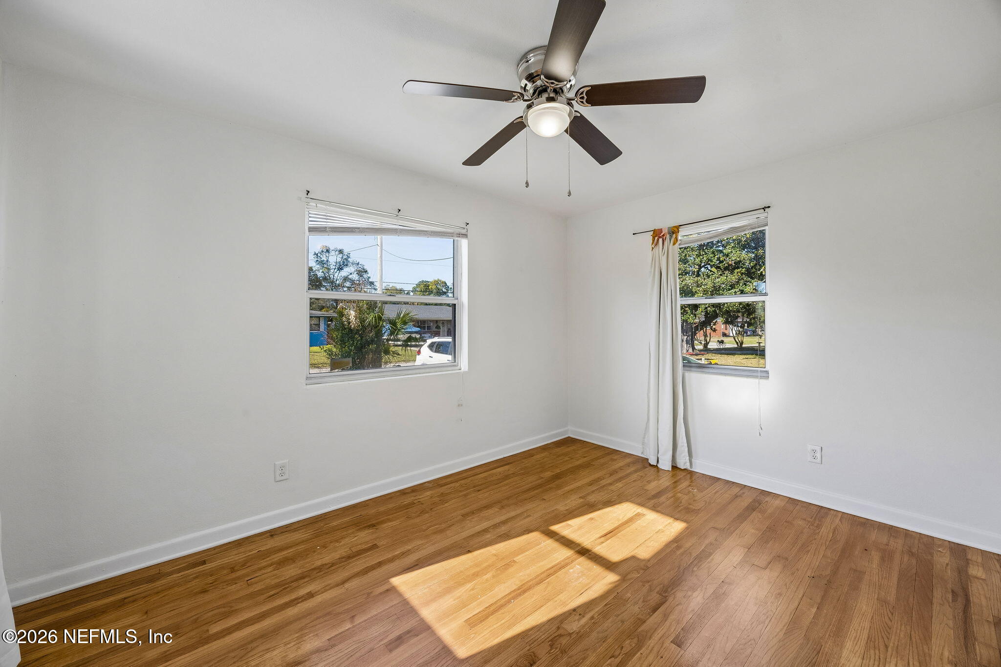3647 Coronado Road Jacksonville, FL 32217 - Photo 36 of 49 a view of empty room with wooden floor