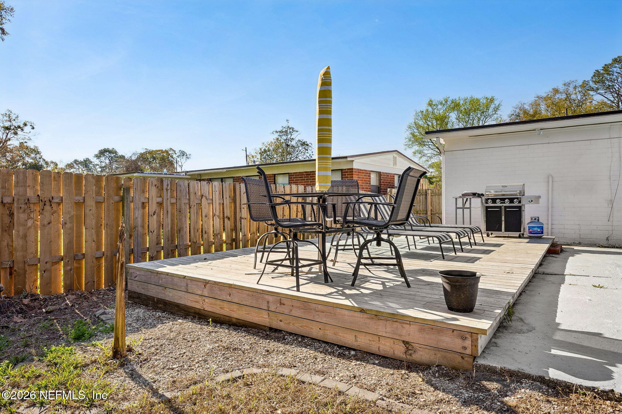 3647 Coronado Road Jacksonville, FL 32217 - Photo 42 of 49 a view of a roof deck with couches and wooden floor
