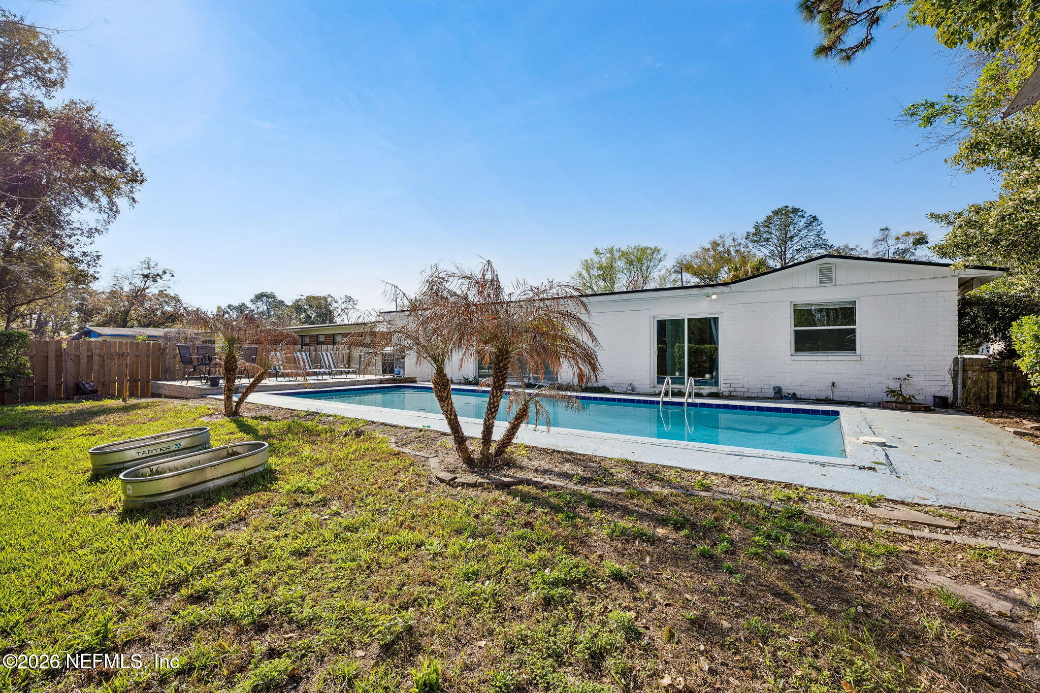 3647 Coronado Road Jacksonville, FL 32217 - Photo 44 of 49 a view of a house with pool and a yard