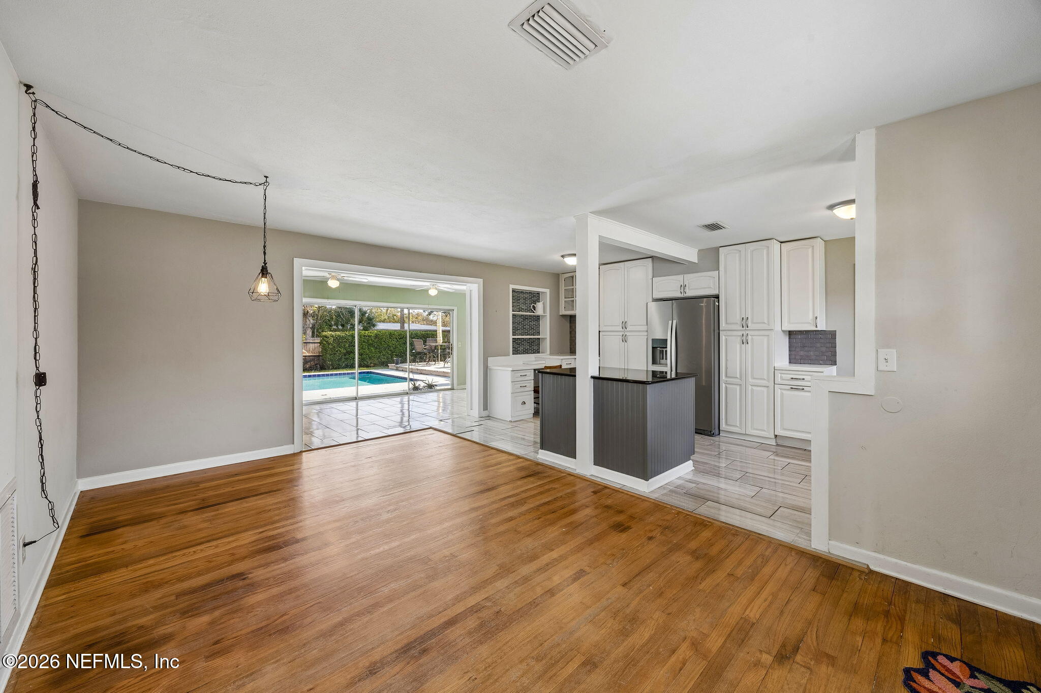 3647 Coronado Road Jacksonville, FL 32217 - Photo 10 of 49 a view of a kitchen with wooden floor and a kitchen