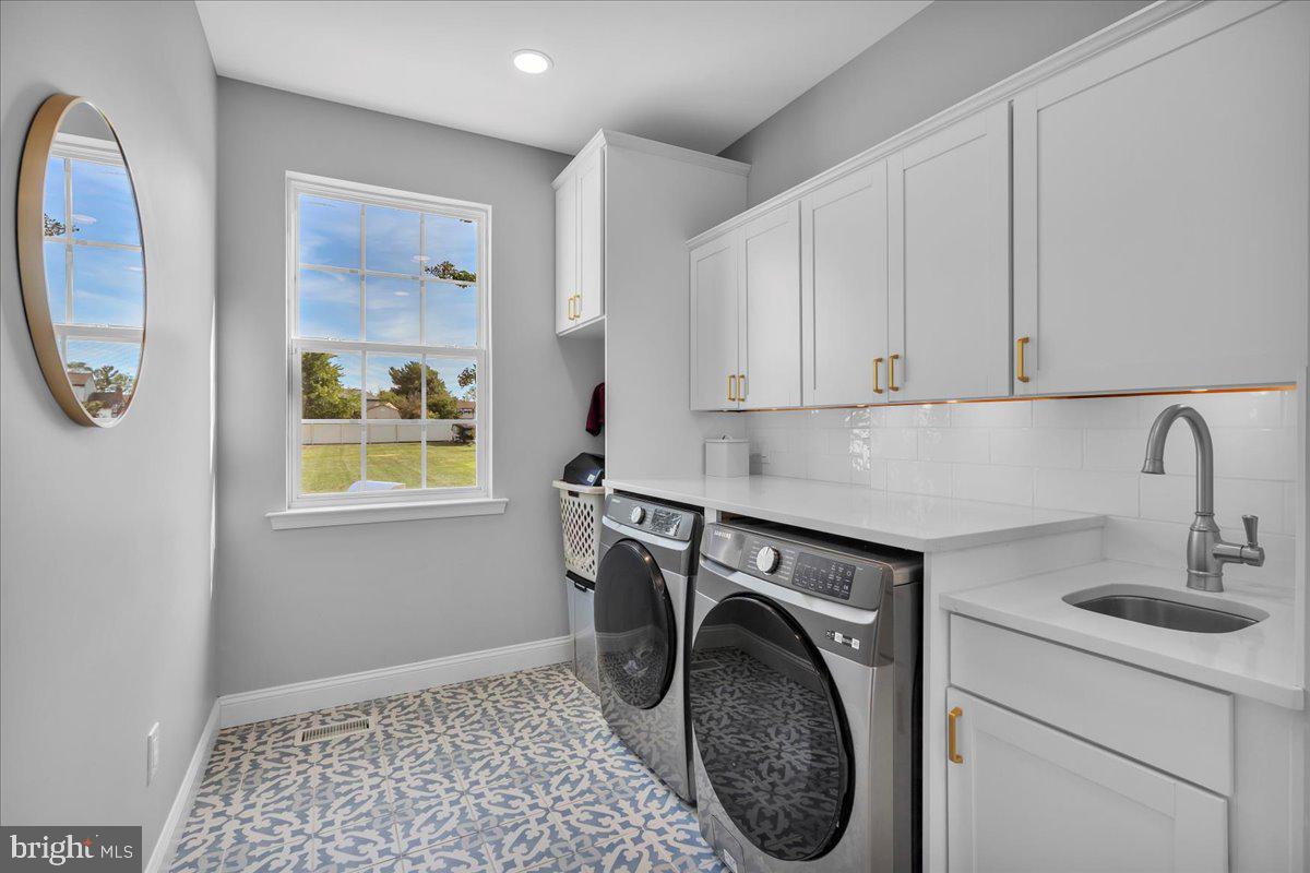 8 Elk Court Sewell, NJ 08080 - Photo 14 of 38 a utility room with sink dryer and washer