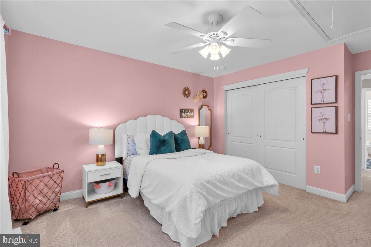 8 Elk Court Sewell, NJ 08080 - Photo 16 of 38 a bedroom with a bed and a chandelier