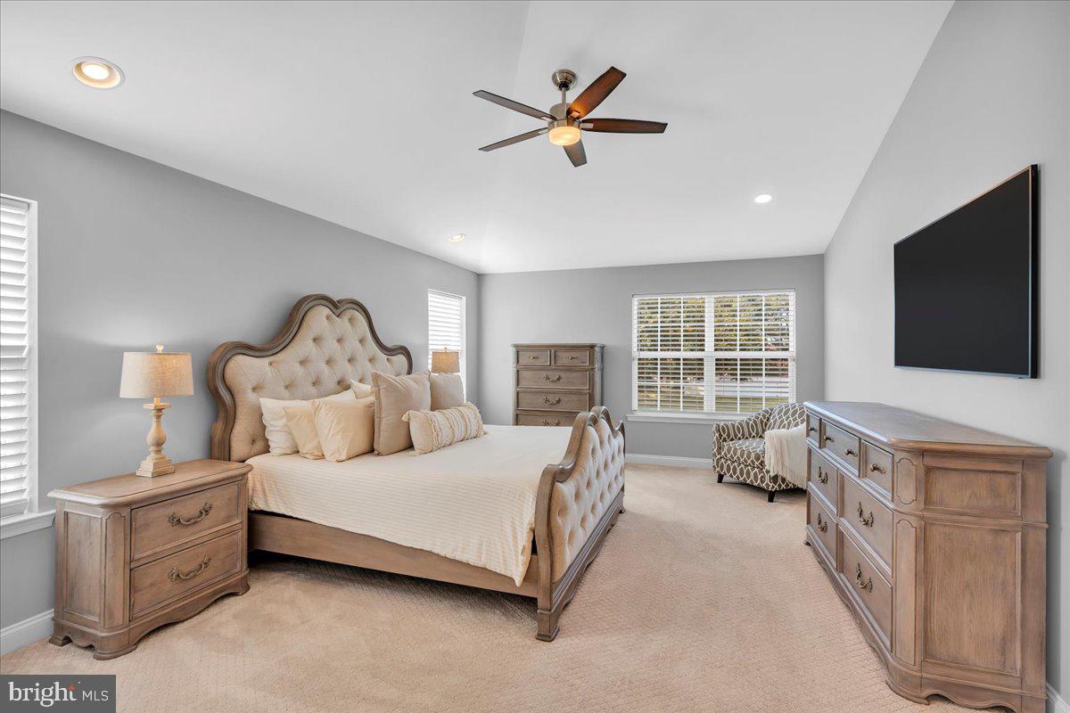 8 Elk Court Sewell, NJ 08080 - Photo 20 of 38 a bedroom with a bed a flat screen tv and a couch