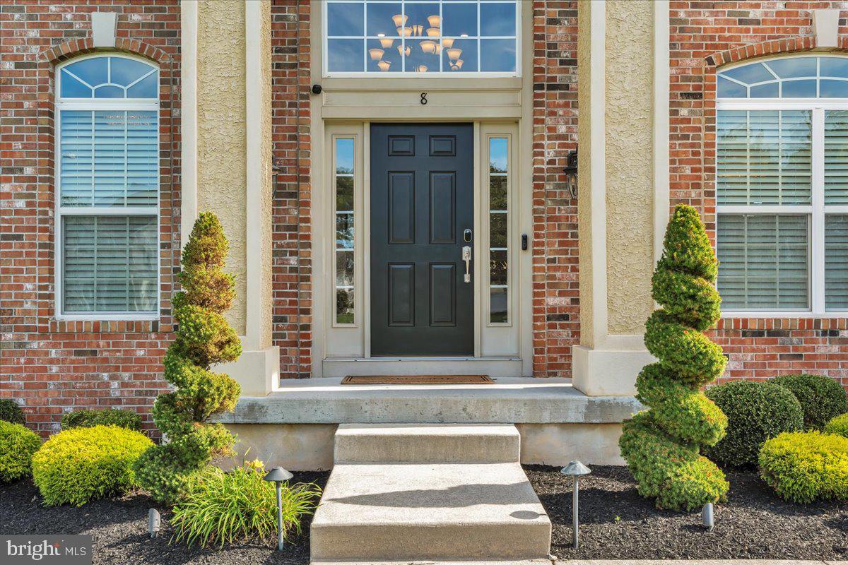 8 Elk Court Sewell, NJ 08080 - Photo 2 of 38 a front view of a house with a garden
