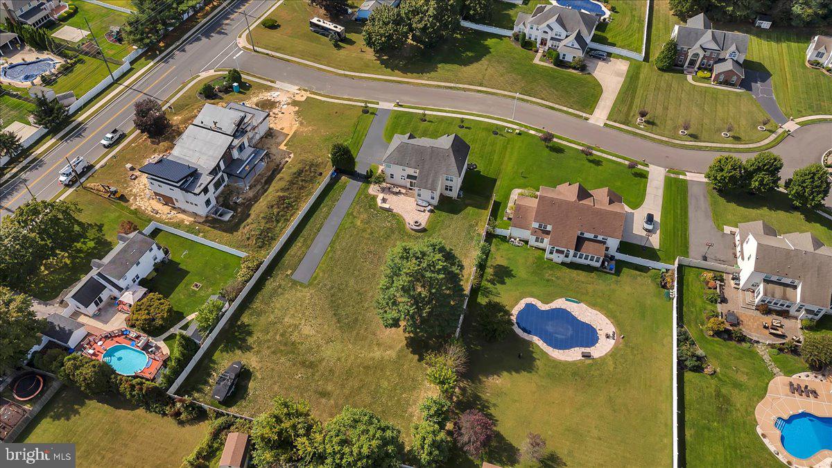 8 Elk Court Sewell, NJ 08080 - Photo 36 of 38 an aerial view of a house with a swimming pool