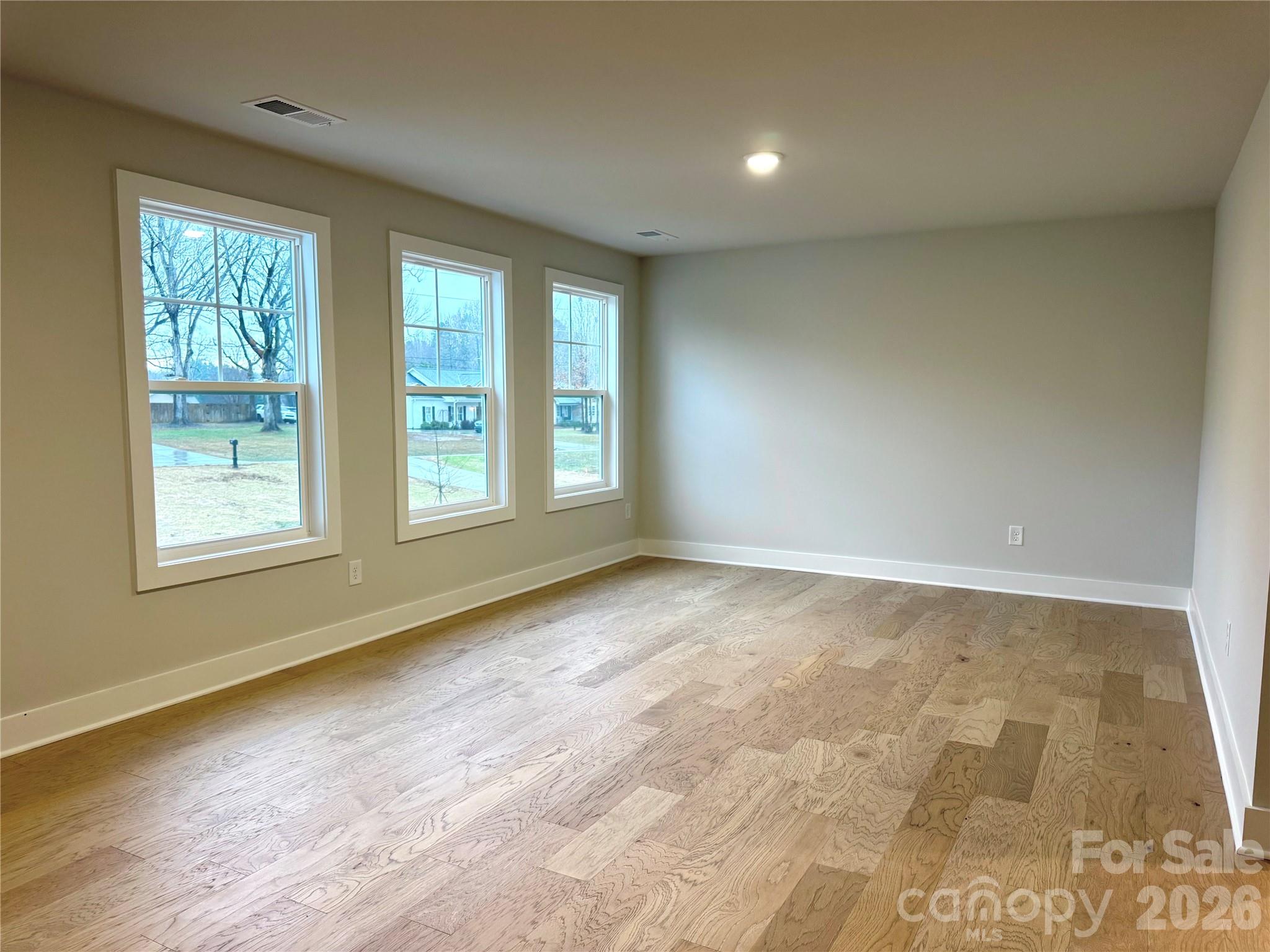 6229 King Wilkinson Road Denver, NC 28037 - Photo 11 of 13 an empty room with windows