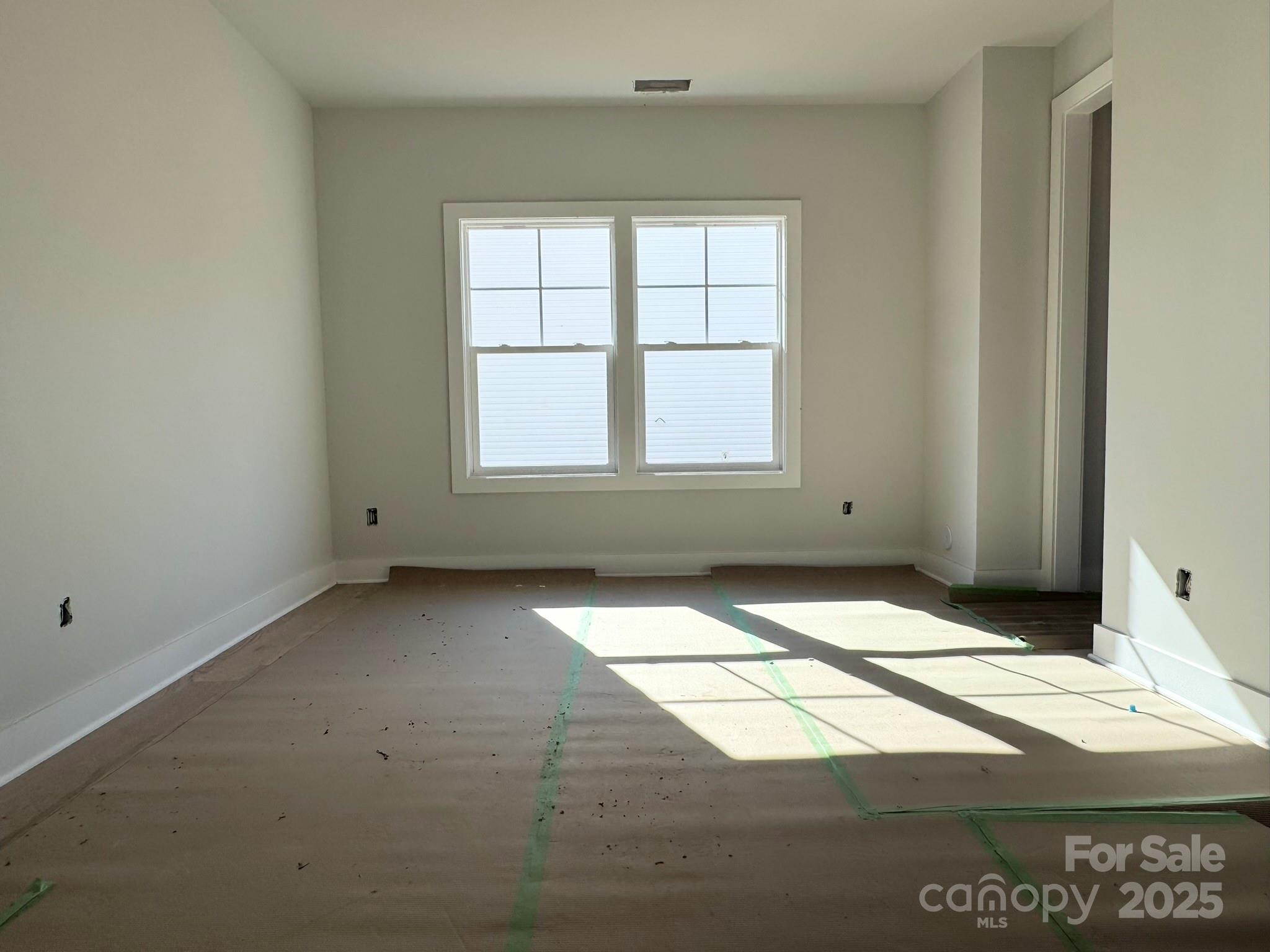 6229 King Wilkinson Road Denver, NC 28037 - Photo 3 of 14 an empty room with a window
