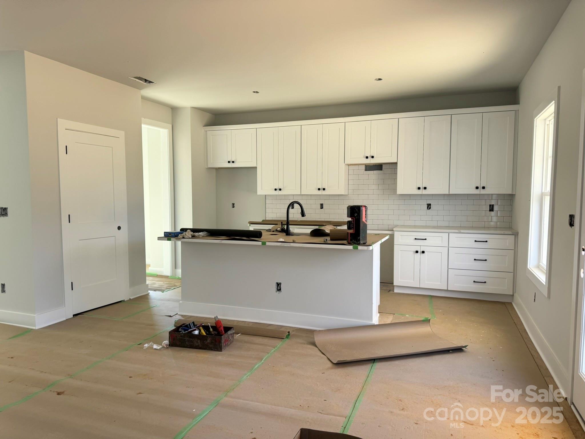 6229 King Wilkinson Road Denver, NC 28037 - Photo 4 of 14 a kitchen with cabinets and a stove top oven
