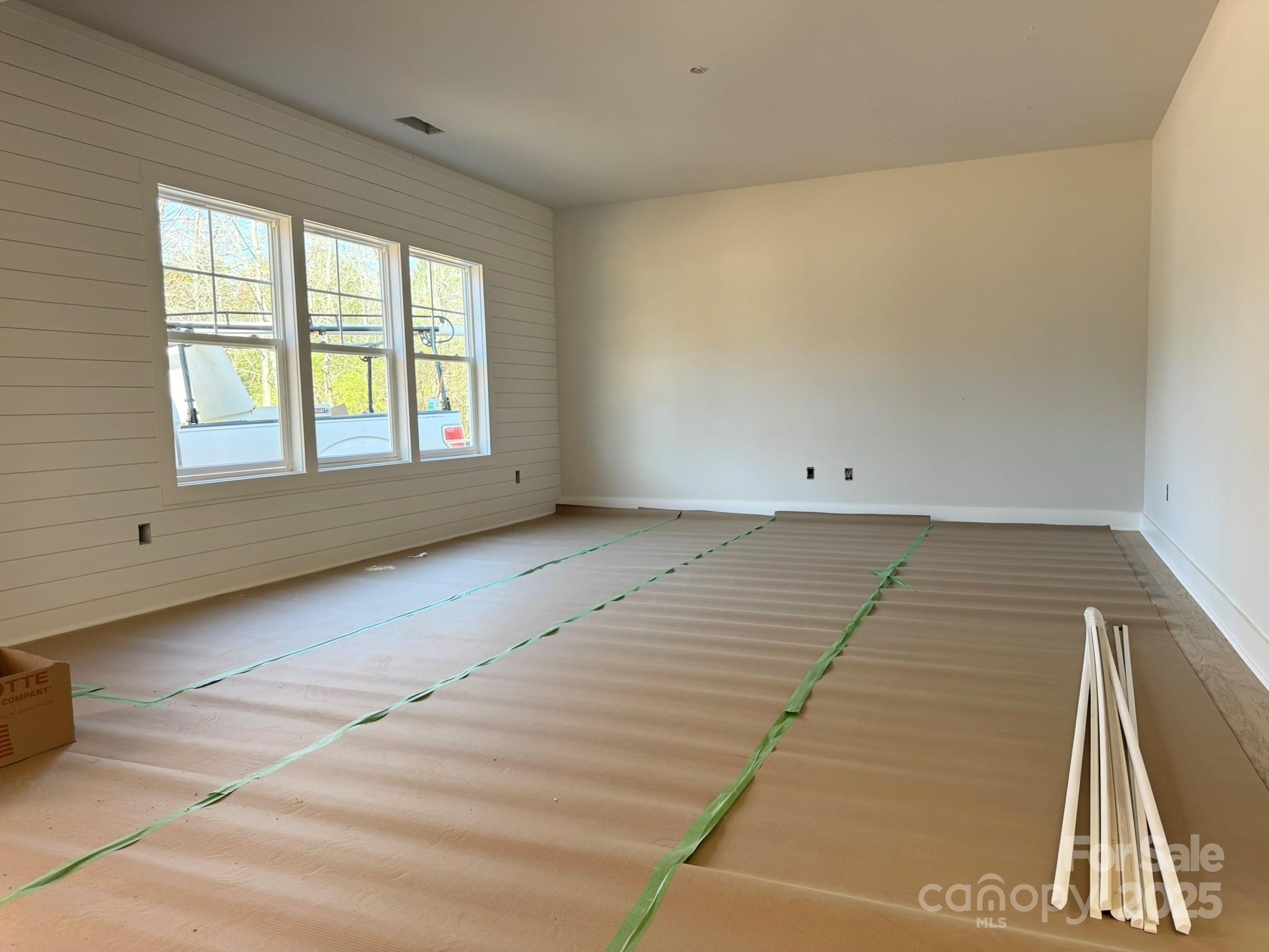 6229 King Wilkinson Road Denver, NC 28037 - Photo 5 of 14 an empty room with windows
