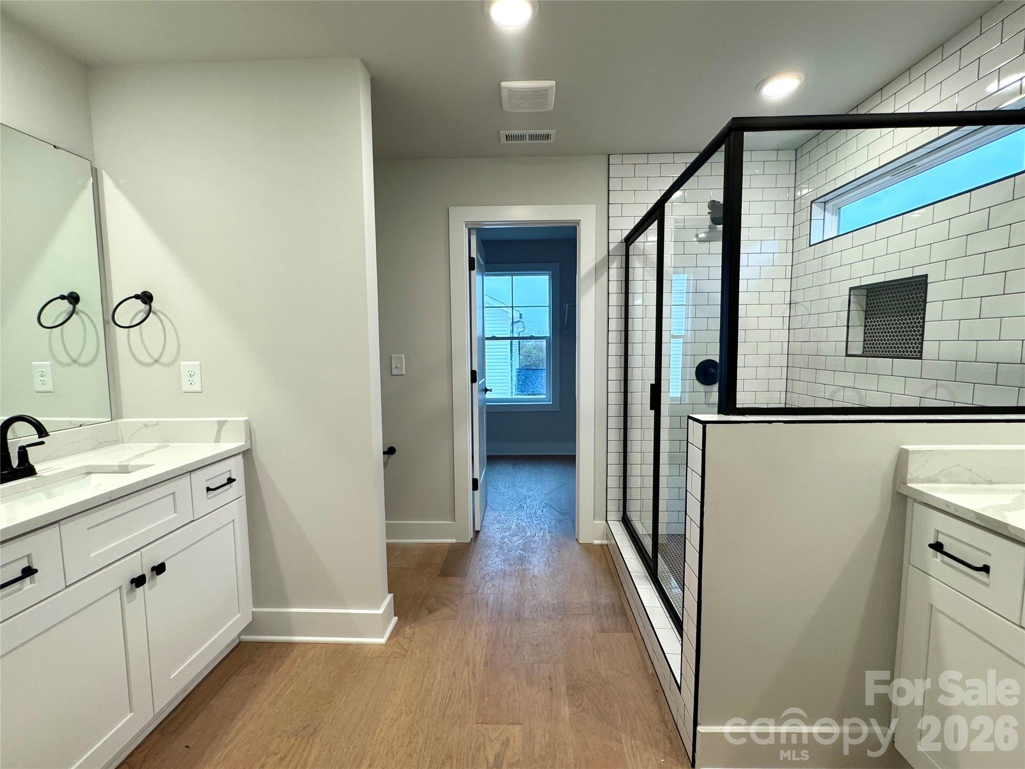 6229 King Wilkinson Road Denver, NC 28037 - Photo 7 of 13 a view of a bathroom from the hallway