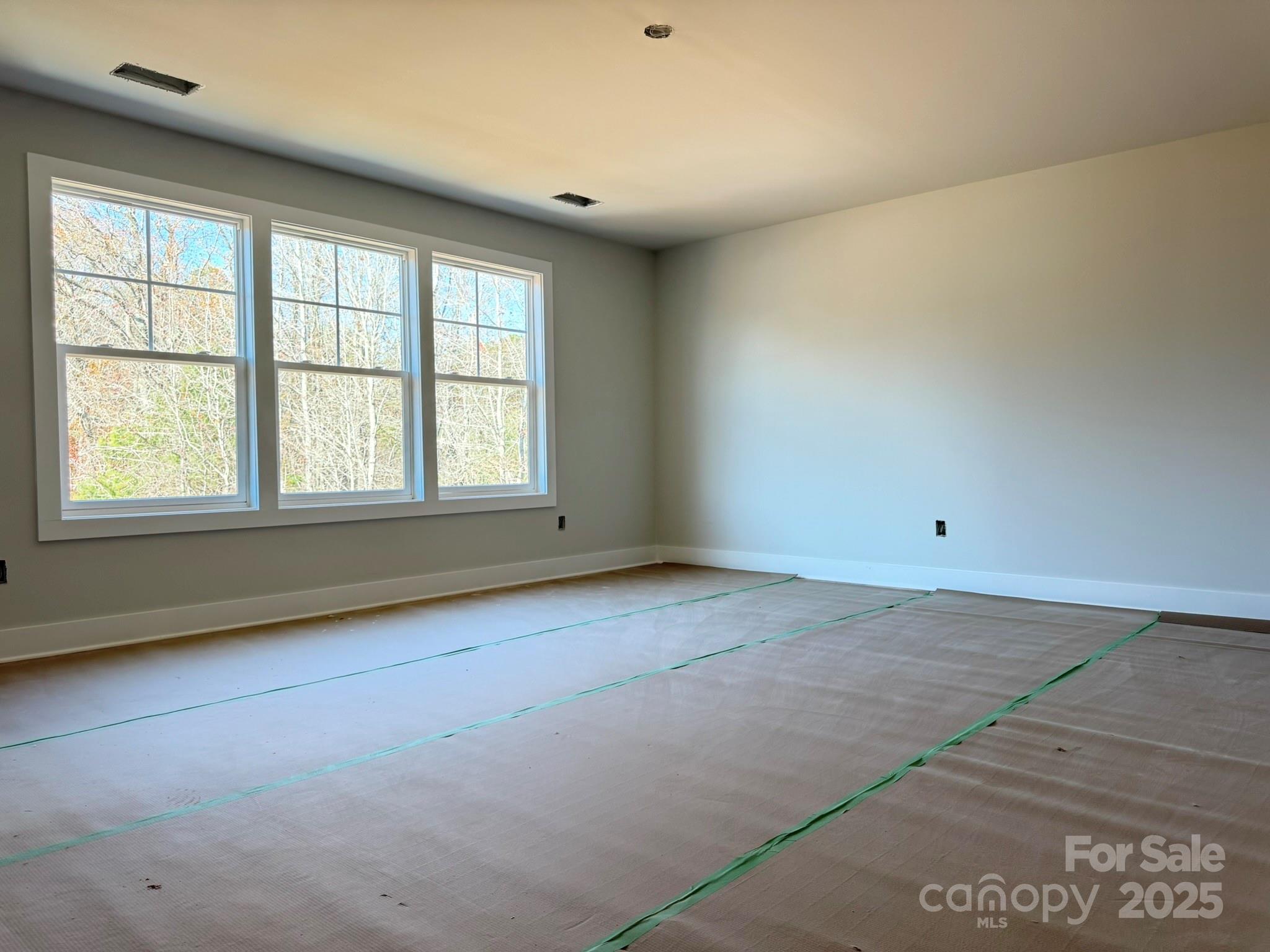 6229 King Wilkinson Road Denver, NC 28037 - Photo 8 of 14 an empty room with a window