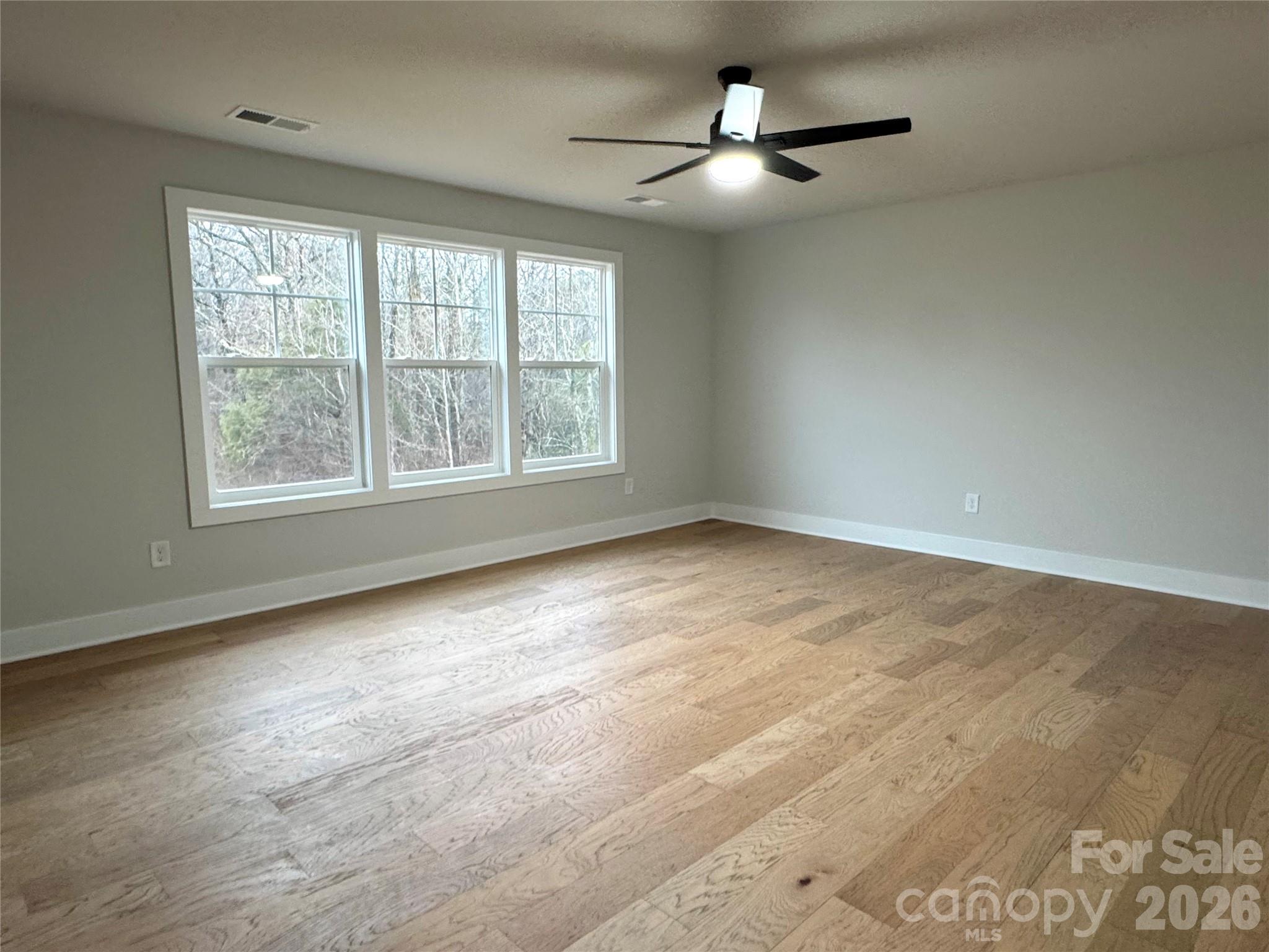 6229 King Wilkinson Road Denver, NC 28037 - Photo 8 of 13 a view of an empty room with a window