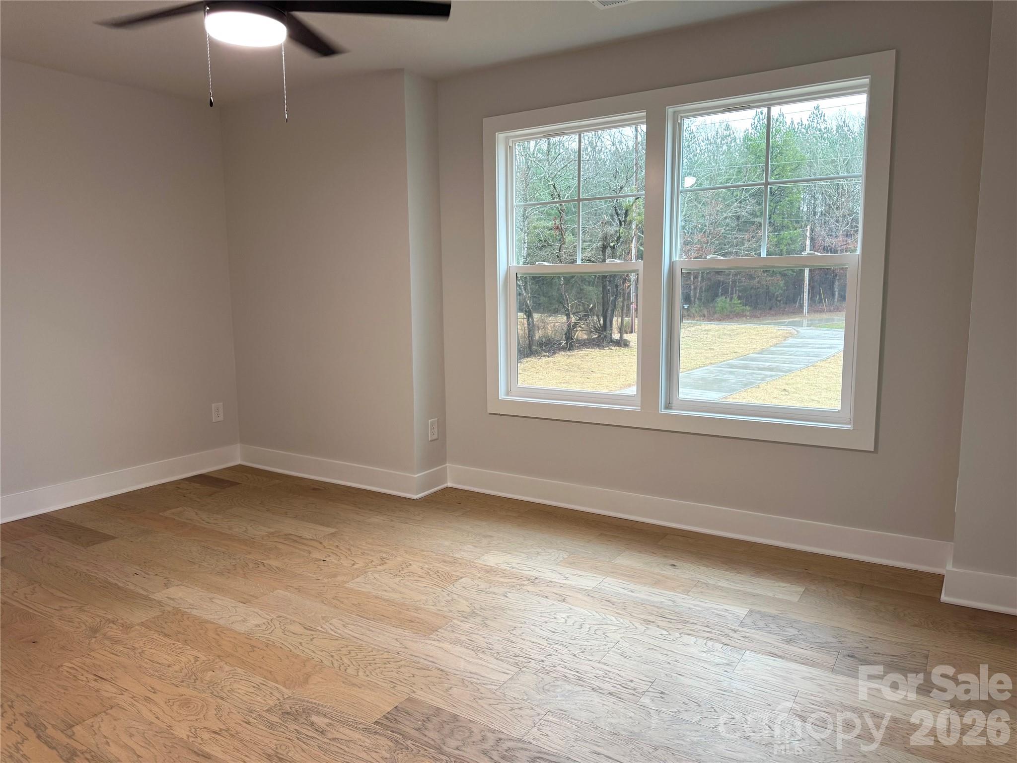 6229 King Wilkinson Road Denver, NC 28037 - Photo 10 of 13 an empty room with a window