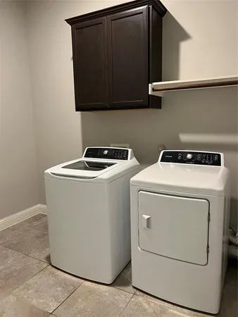 a room with a window and a ceiling fan