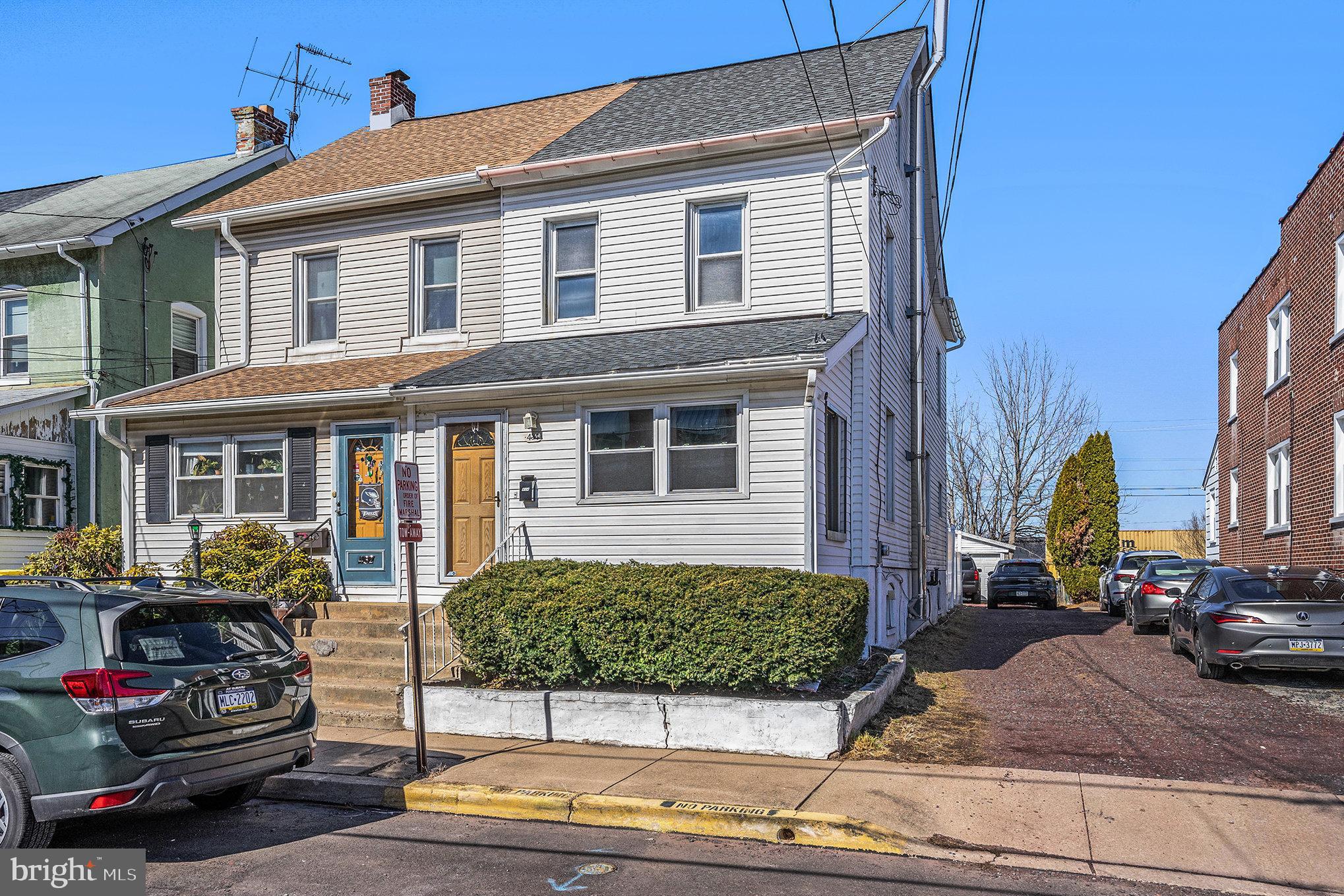 434 Pierce Street Lansdale, PA 19446 - Photo 2 of 25 a front view of a house with cars parked