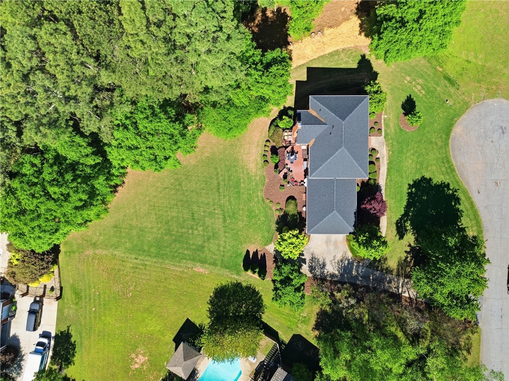 103 5 Knoll Court Anderson, SC 29621 - Photo 31 of 33 An aerial perspective reveals a private residence nestled amidst lush green landscaping, featuring an inviting outdoor pool.