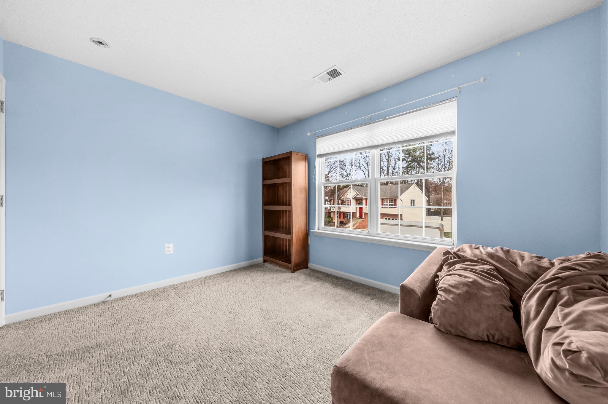 115 Myrtleleaf Circle La Plata, MD 20646 - Photo 17 of 37 a bedroom with a bed and a large window